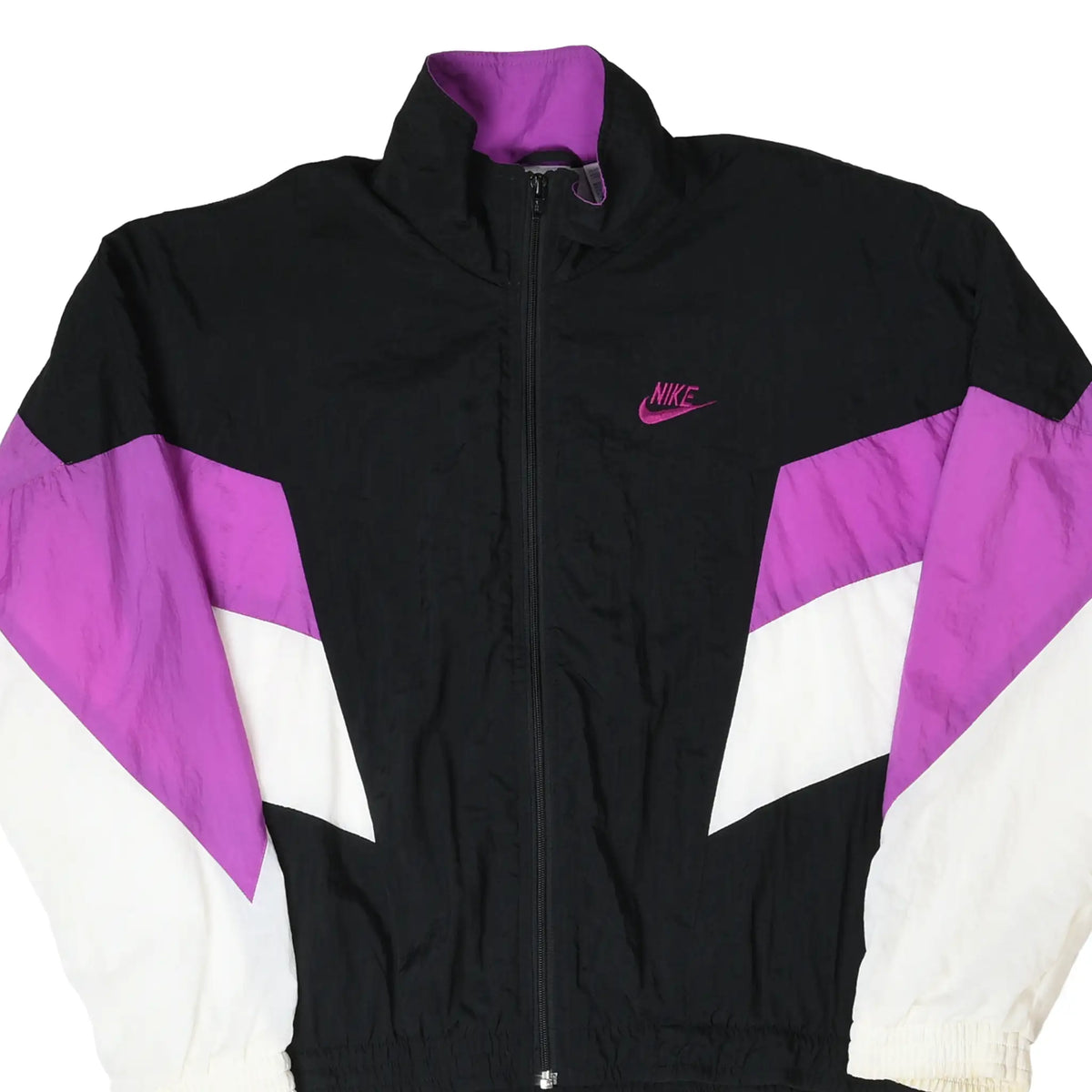 Front close-up of black Nike windbreaker with purple and white sleeves and purple Swoosh embroidery