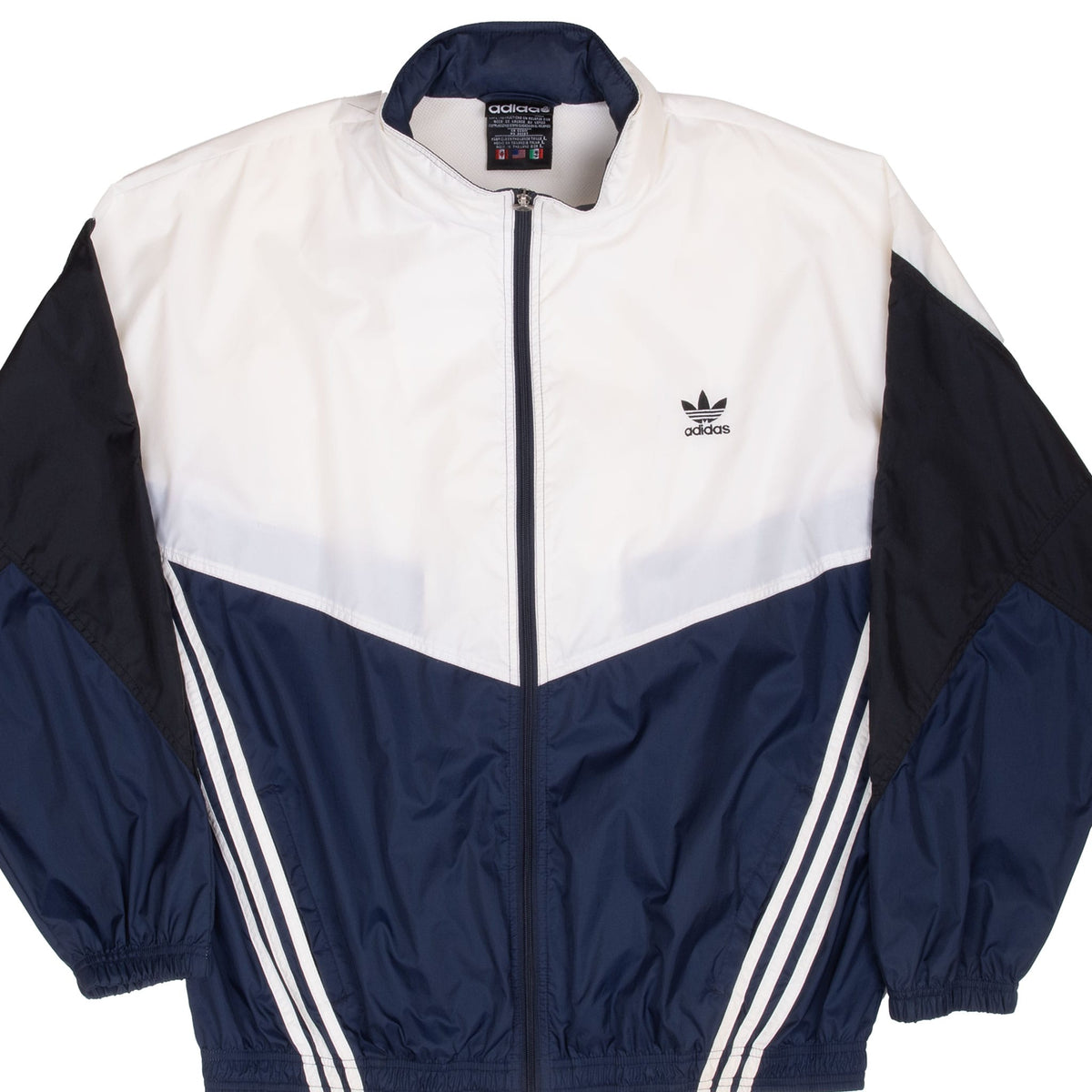 Front view of Adidas color-block windbreaker in white, navy blue and black with Trefoil chest logo