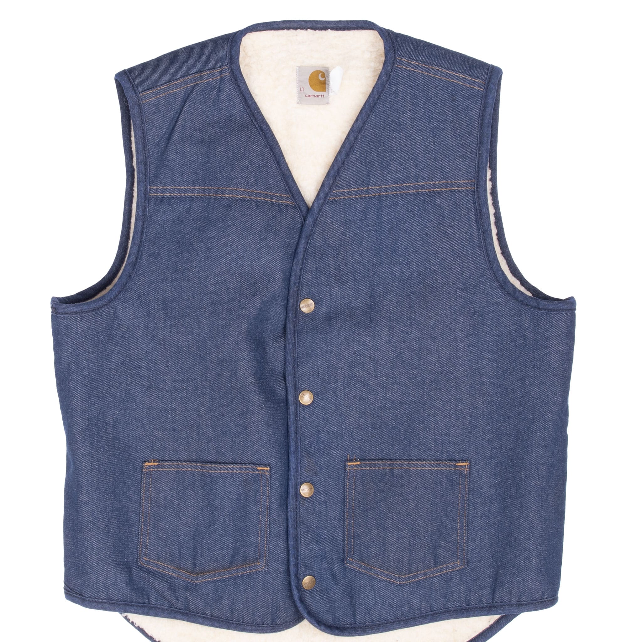 Front of dark blue Carhartt denim vest with sherpa lining, snap closures and patch pockets