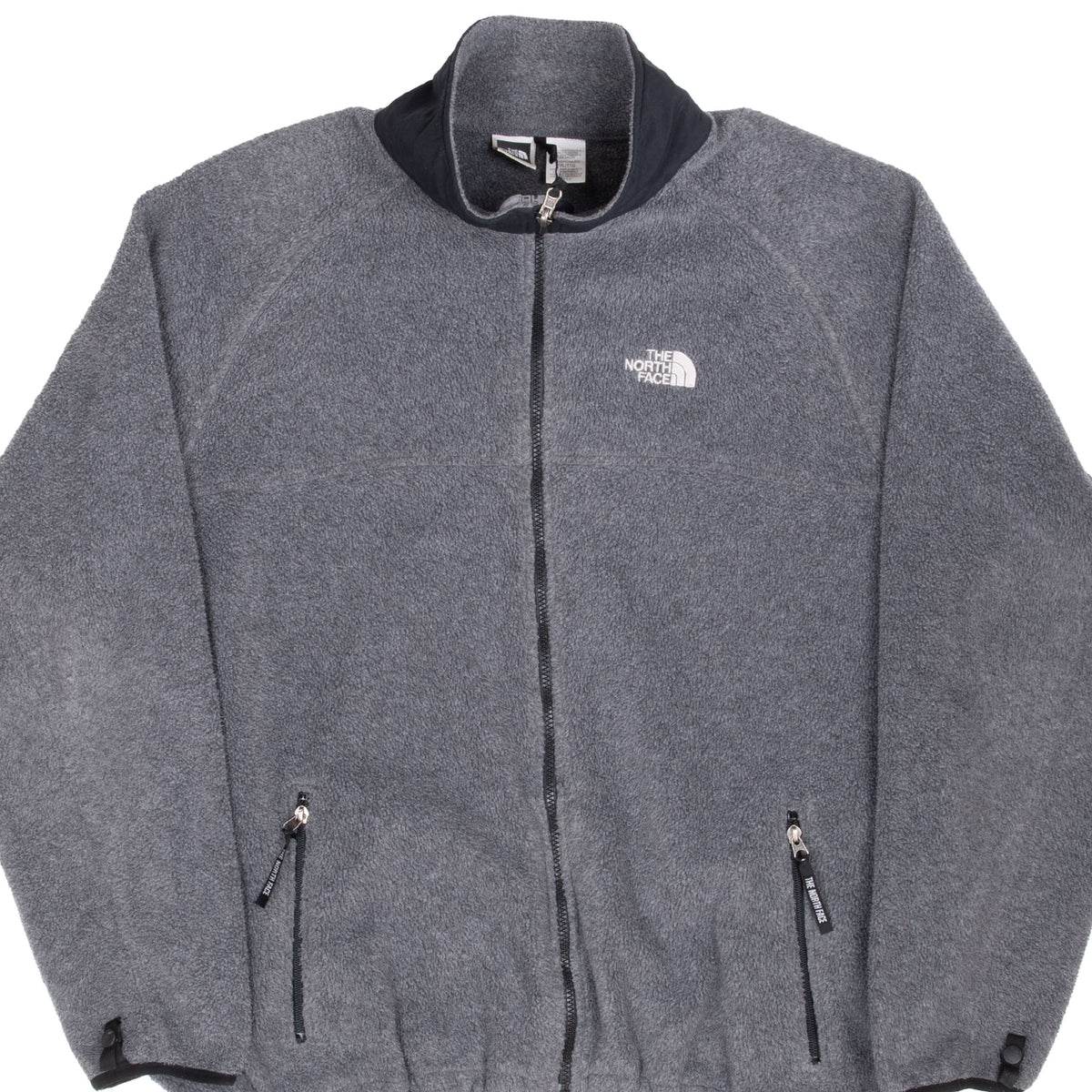 Front of grey The North Face fleece jacket with black collar and zippered hand pockets