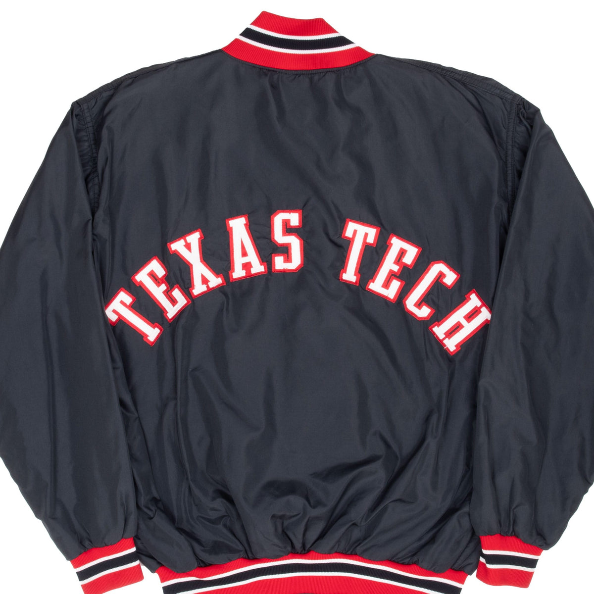 Back of black Texas Tech bomber jacket with arched white and red lettering