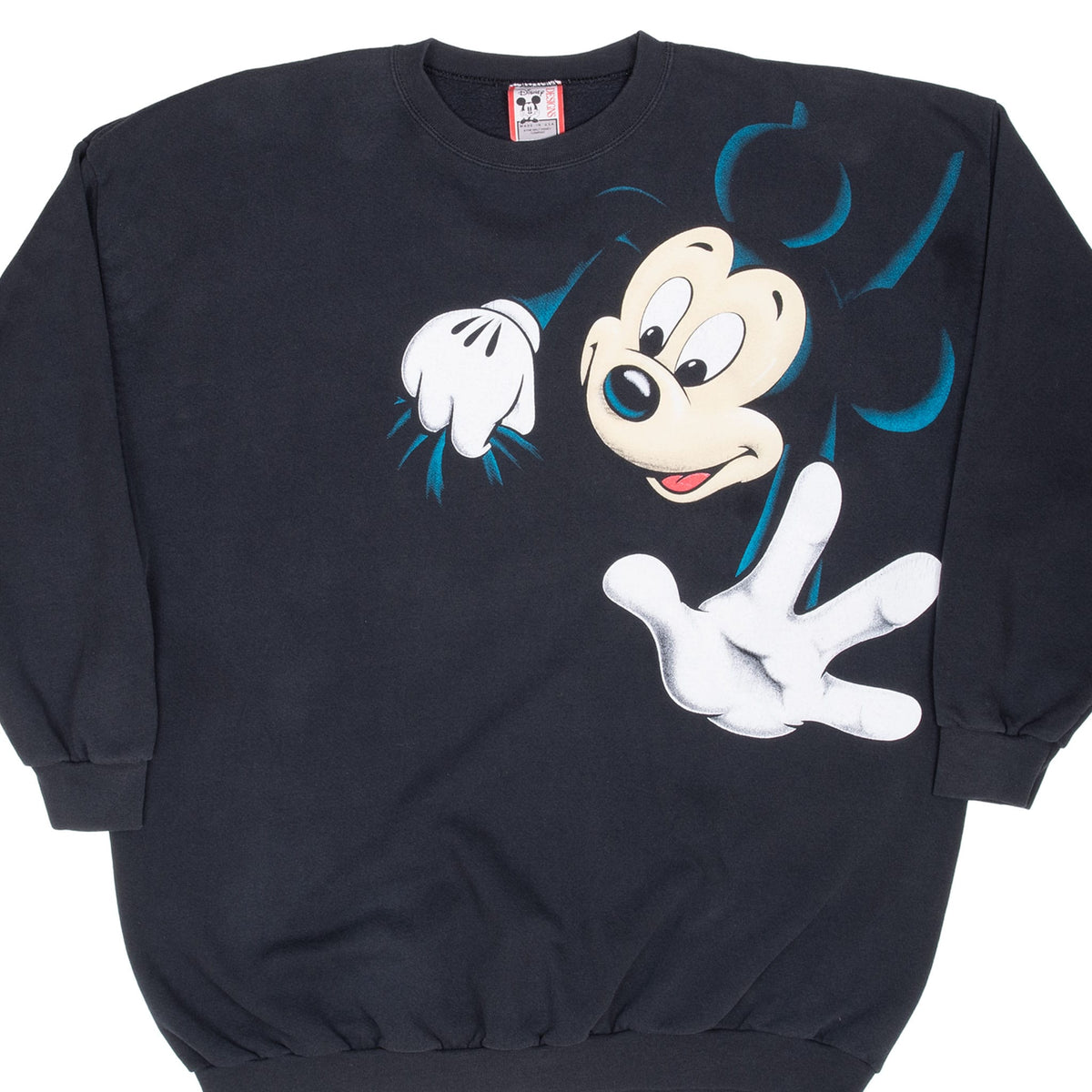 Front of black Disney crewneck sweatshirt with oversized Mickey Mouse graphic