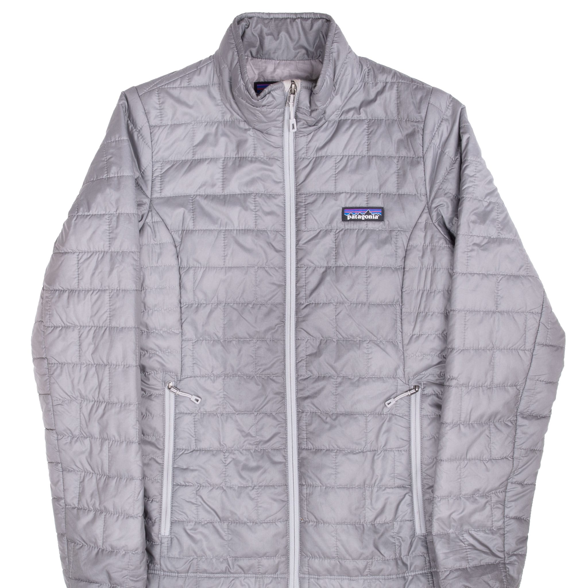 Front of grey Patagonia women's Nano Puff jacket with quilted panels and zip pockets