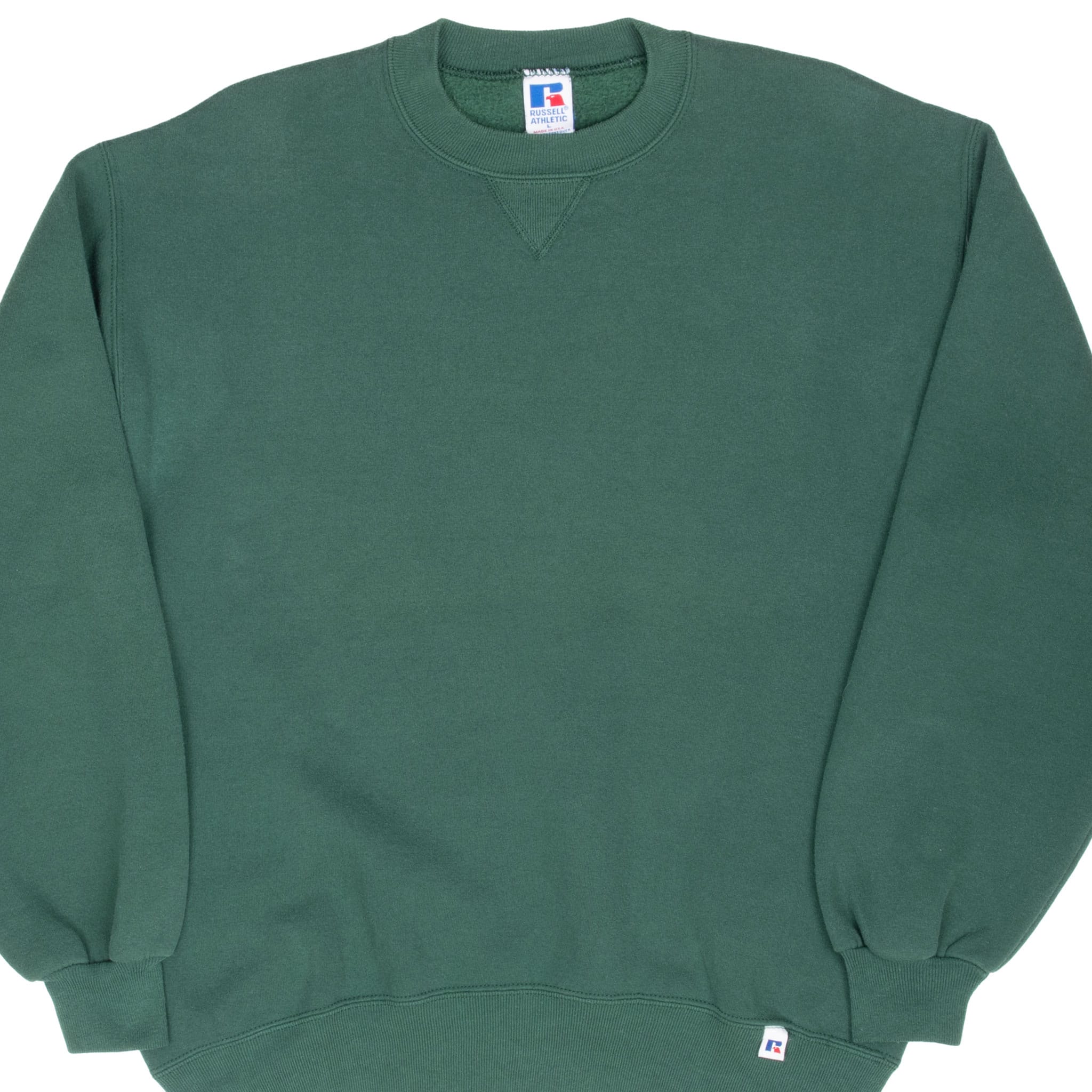Front detail of green Russell Athletic crewneck sweatshirt with V-stitch and logo tab
