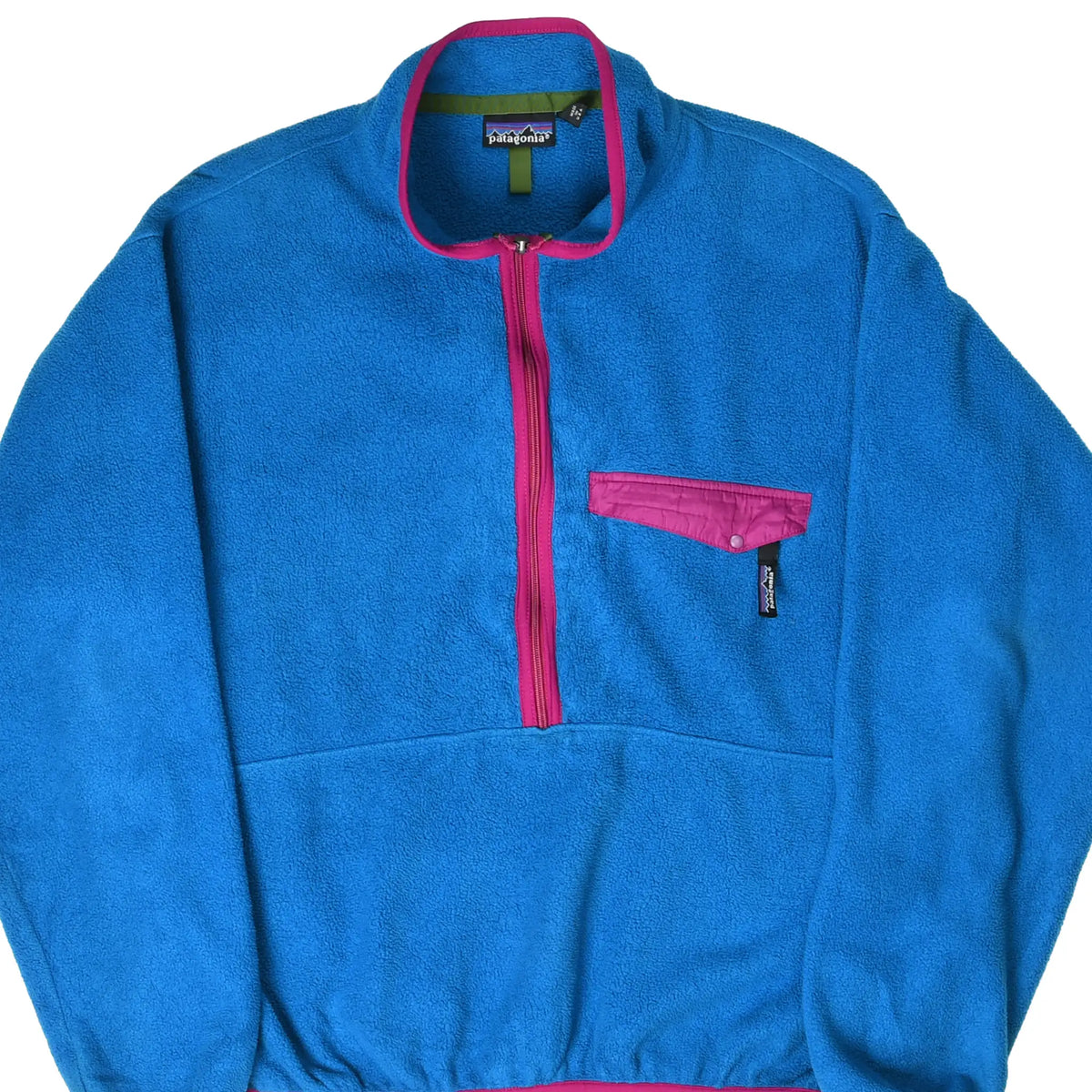 Front of blue Patagonia half-zip fleece pullover with magenta trim and snap chest pocket