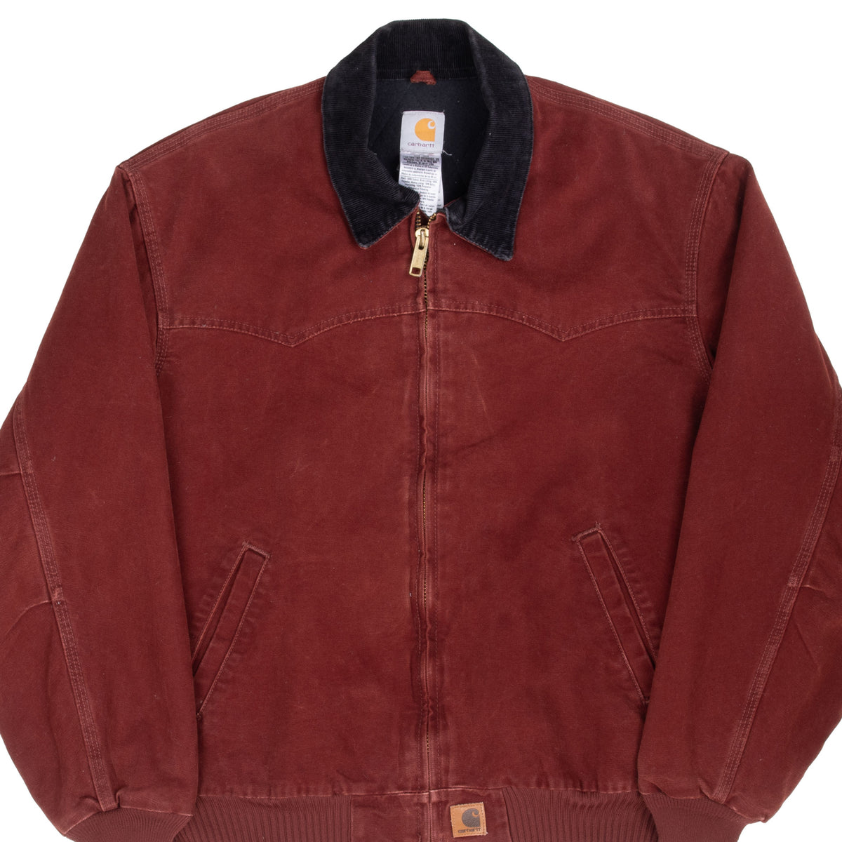 Front of clay red Carhartt Santa Fe jacket with dark collar, Western yoke and angled pockets