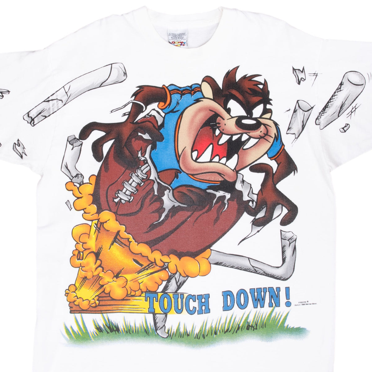 Close-up of Taz football graphic with blue “Touch Down!” text on white T-shirt