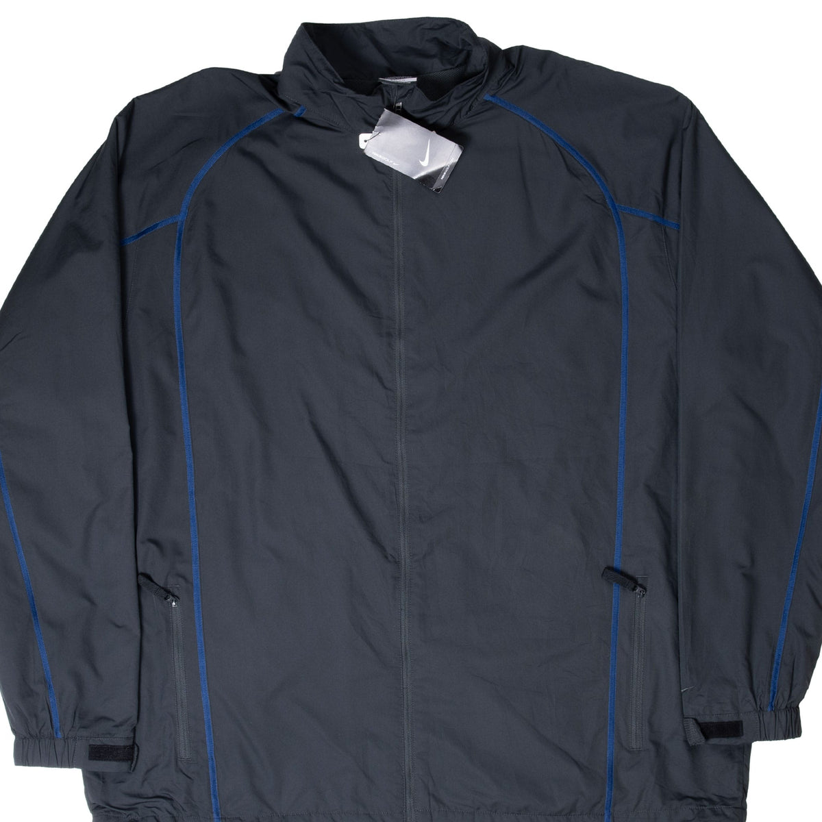 Front of black Nike Golf windbreaker with blue piping, zip pockets, cuff tabs, and hangtags