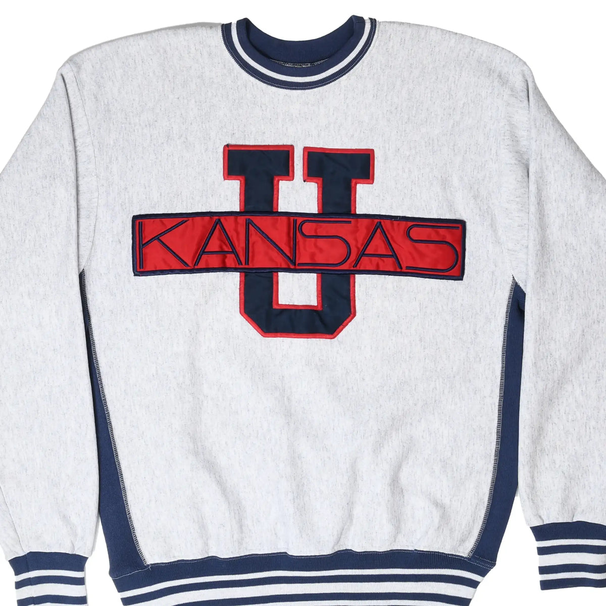 Front of grey Kansas University sweatshirt with navy and red U graphic and striped ribbed trim