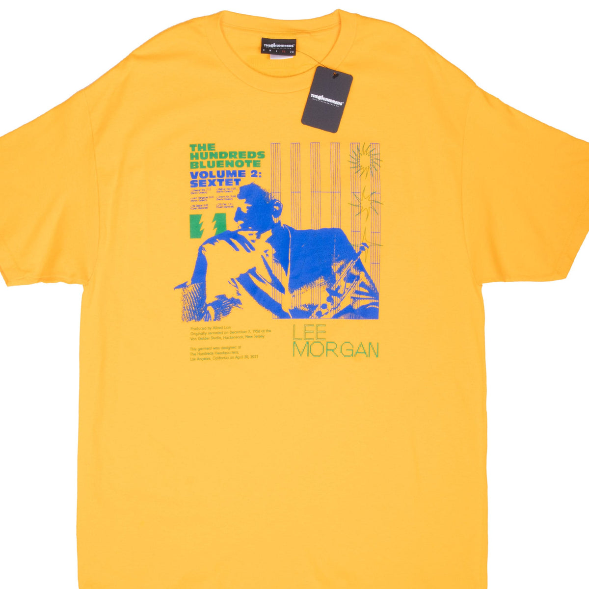 Front close view of yellow The Hundreds x Blue Note Lee Morgan Sextet T-shirt with attached hangtag