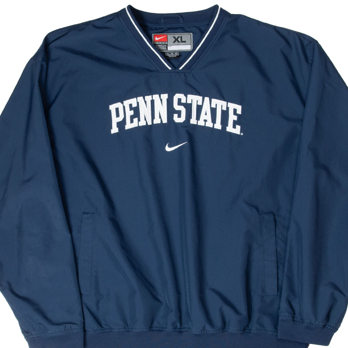 Front of navy Nike Penn State windbreaker with white chest lettering and Swoosh