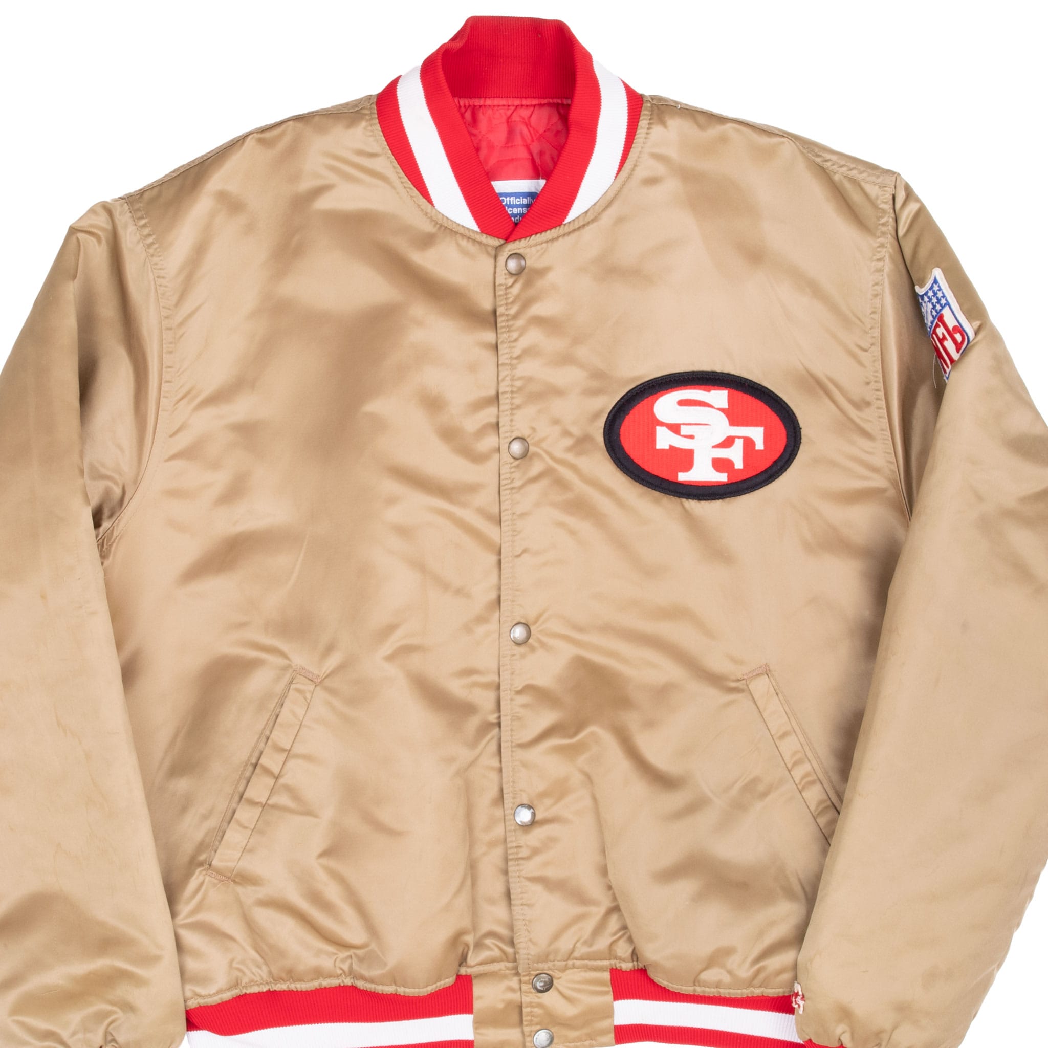 Front detail of gold San Francisco 49ers Starter jacket with chest logo and NFL sleeve patch