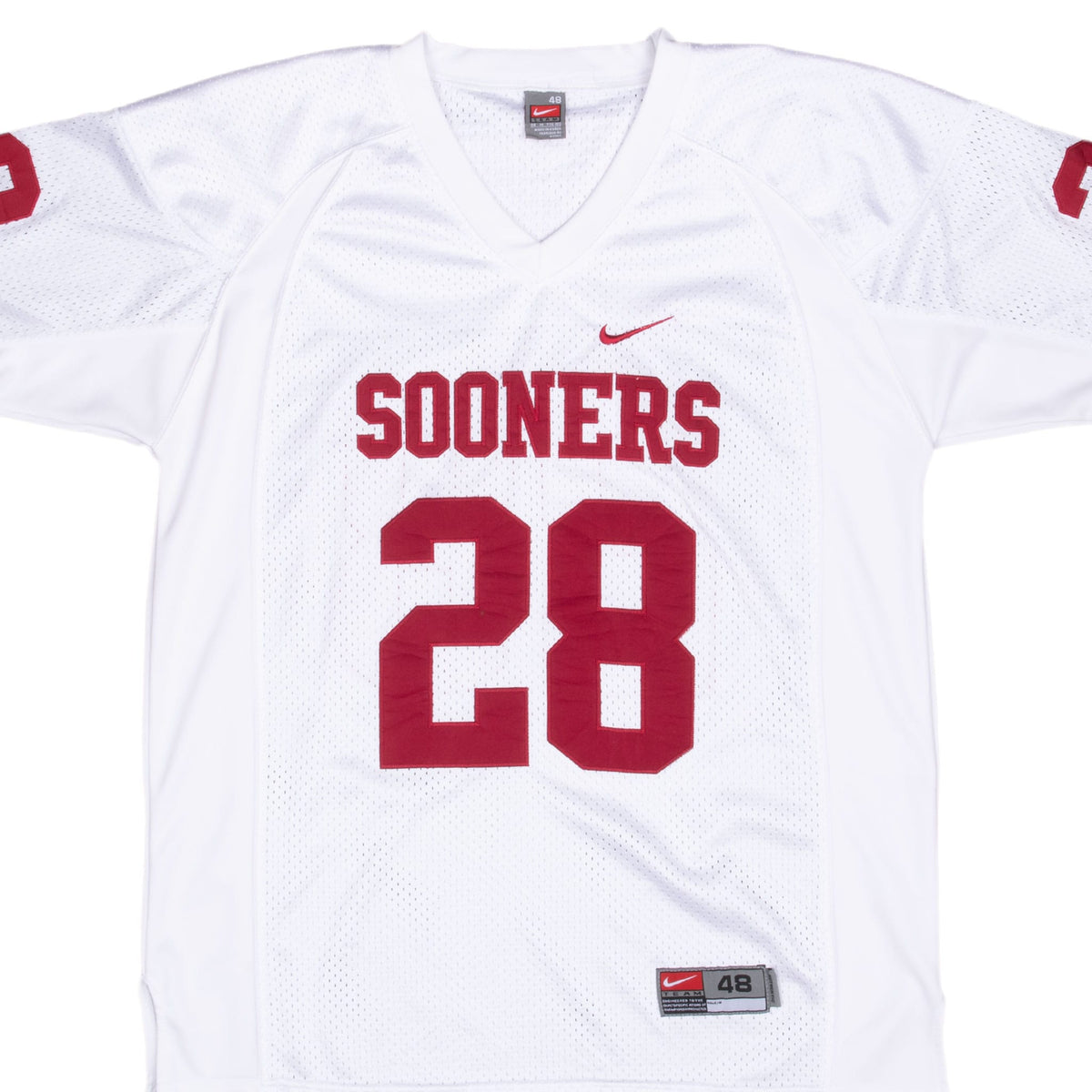 Front detail of white Nike Oklahoma Sooners jersey with crimson 28 and chest lettering