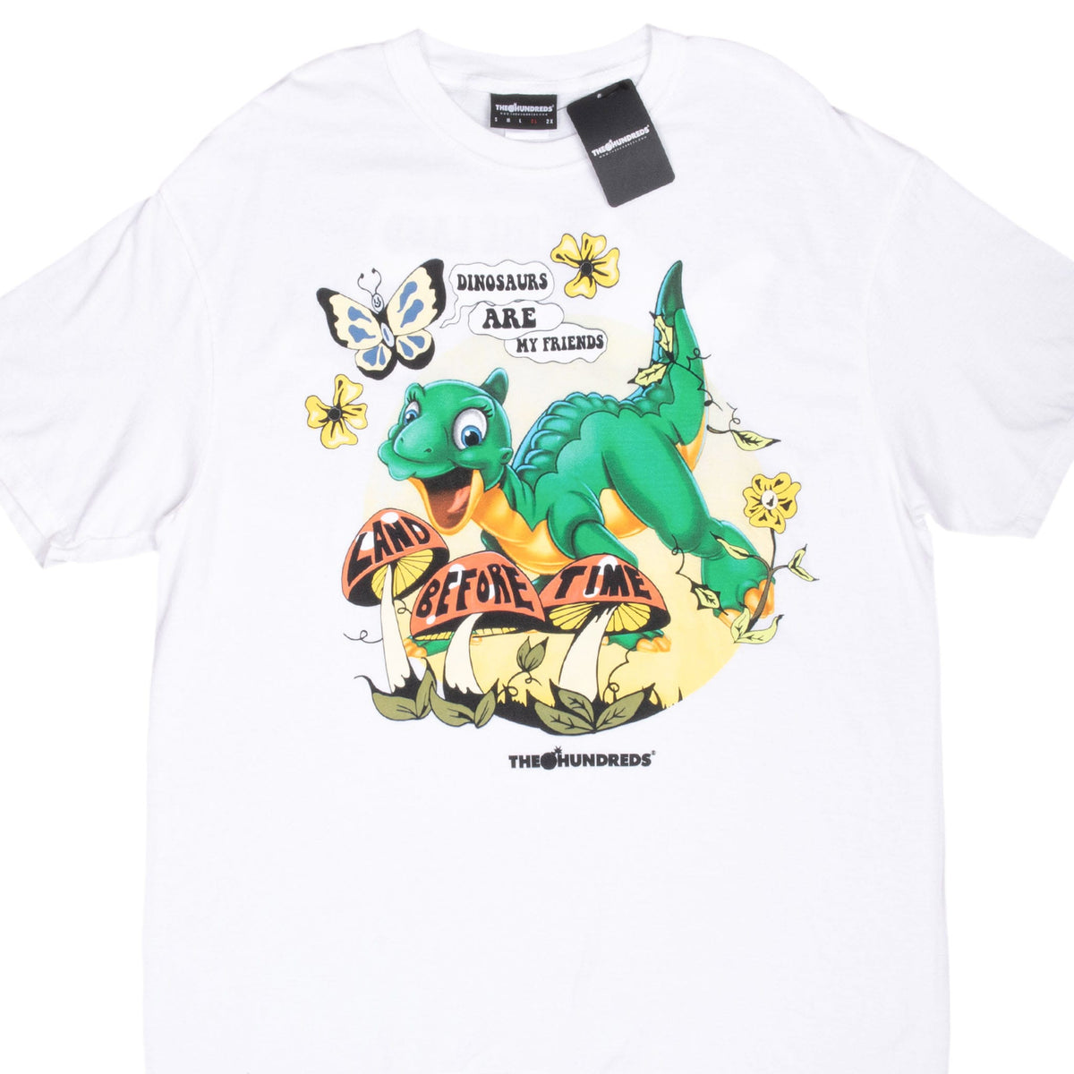 Front of white The Hundreds x The Land Before Time T-shirt with colorful dinosaur graphic and hangtag