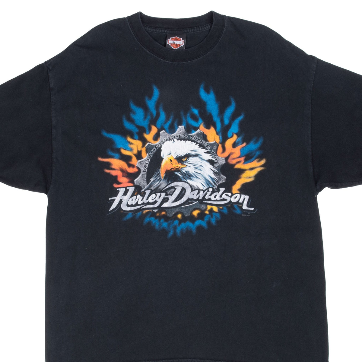 Front of black Harley-Davidson T-shirt with bald eagle, gear, and blue and orange flame graphic