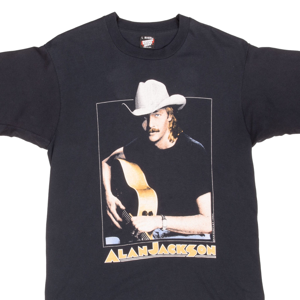 Upper front of black Alan Jackson T-shirt with cowboy hat and guitar portrait graphic
