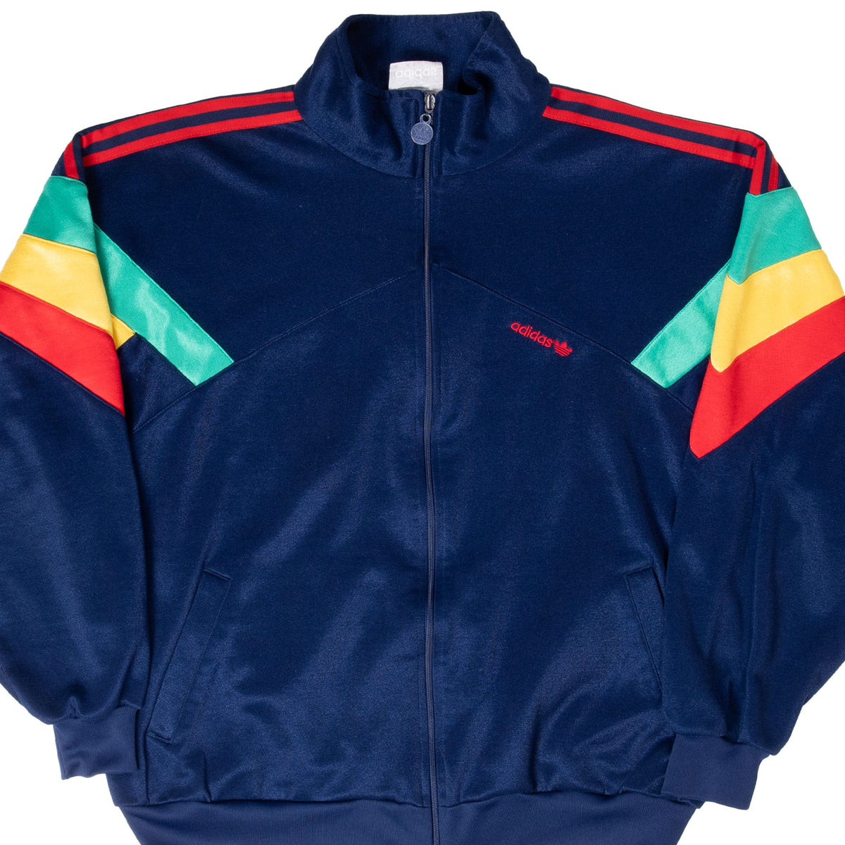 Front detail of navy adidas Jamaica track jacket with red, yellow and green sleeve panels