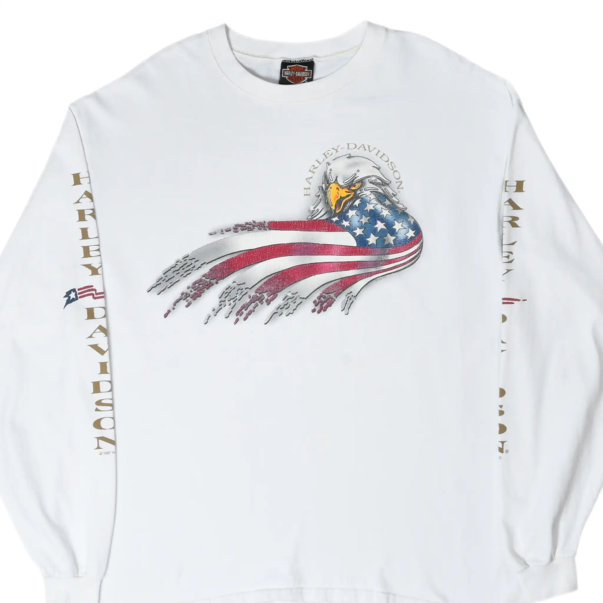 Front of white Harley-Davidson long-sleeve tee with bald eagle and flowing American flag graphic