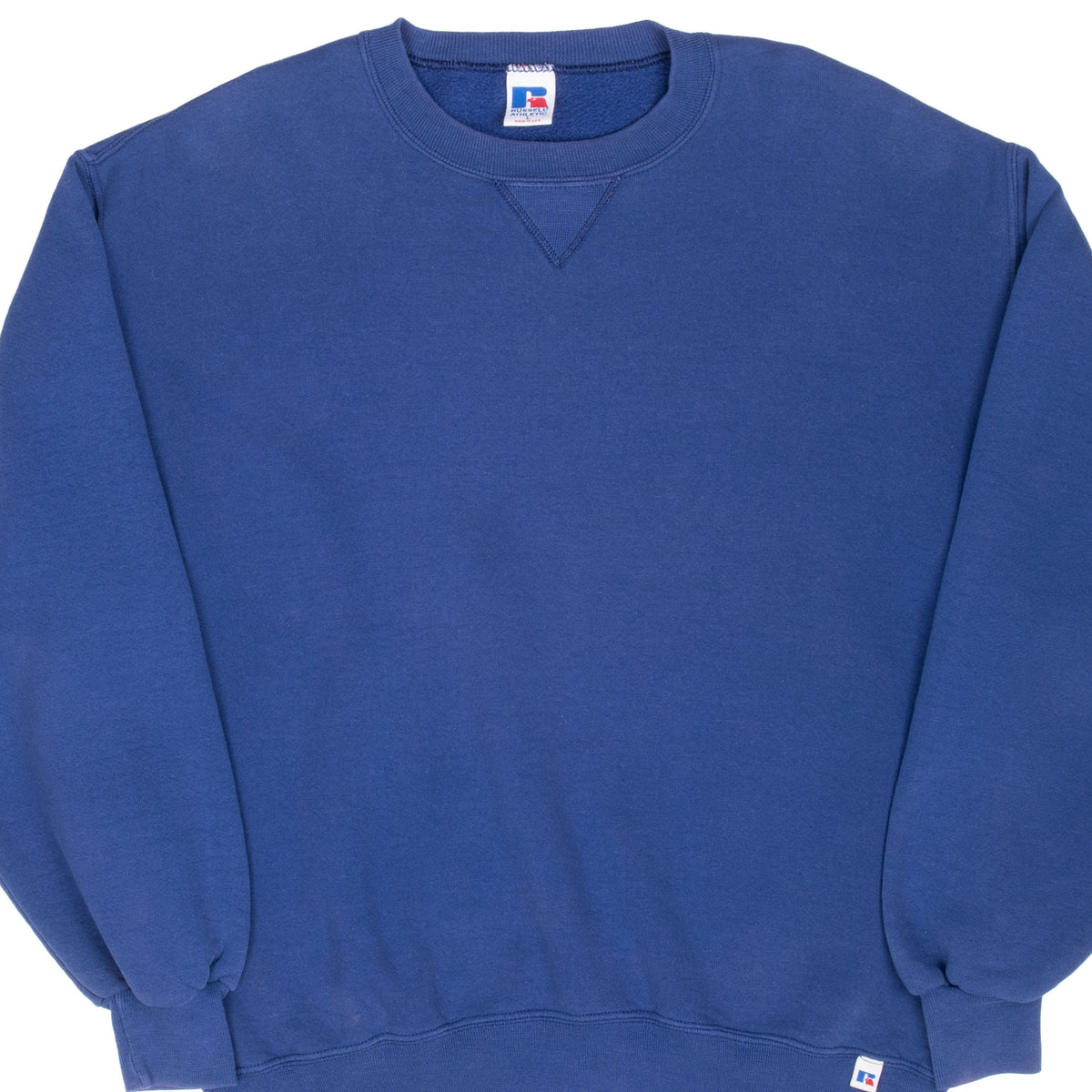 Front detail of blue Russell Athletic blank crewneck sweatshirt