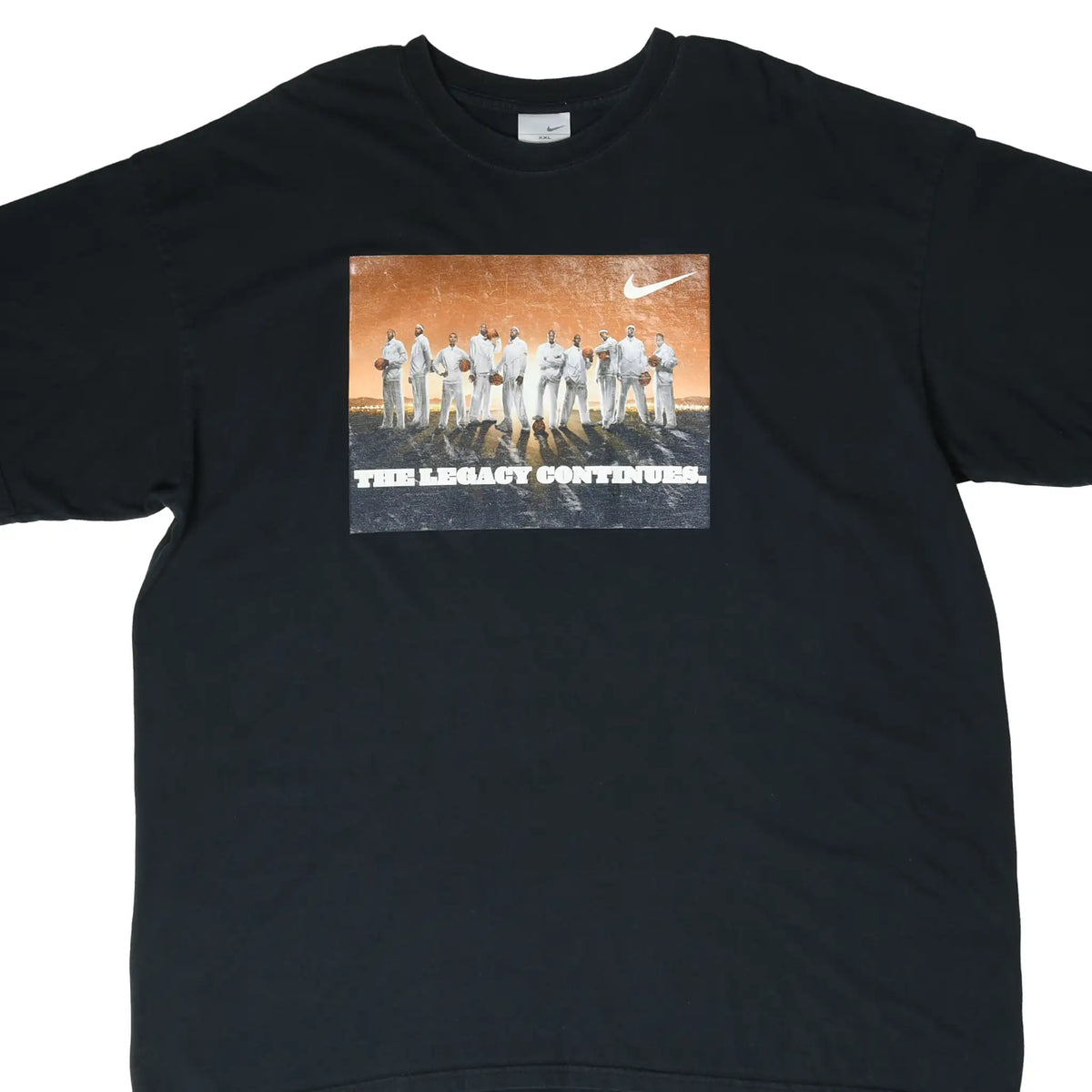 Front of black Nike T-shirt with basketball players and The Legacy Continues graphic