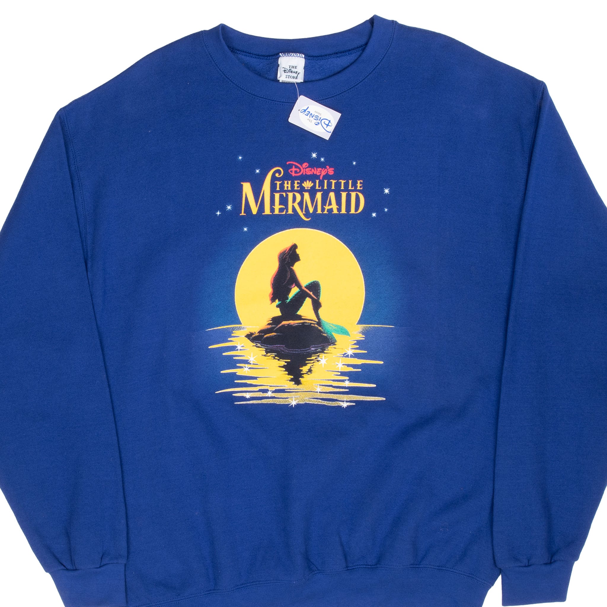 Front of blue Disney The Little Mermaid sweatshirt with Ariel moon graphic and hang tag