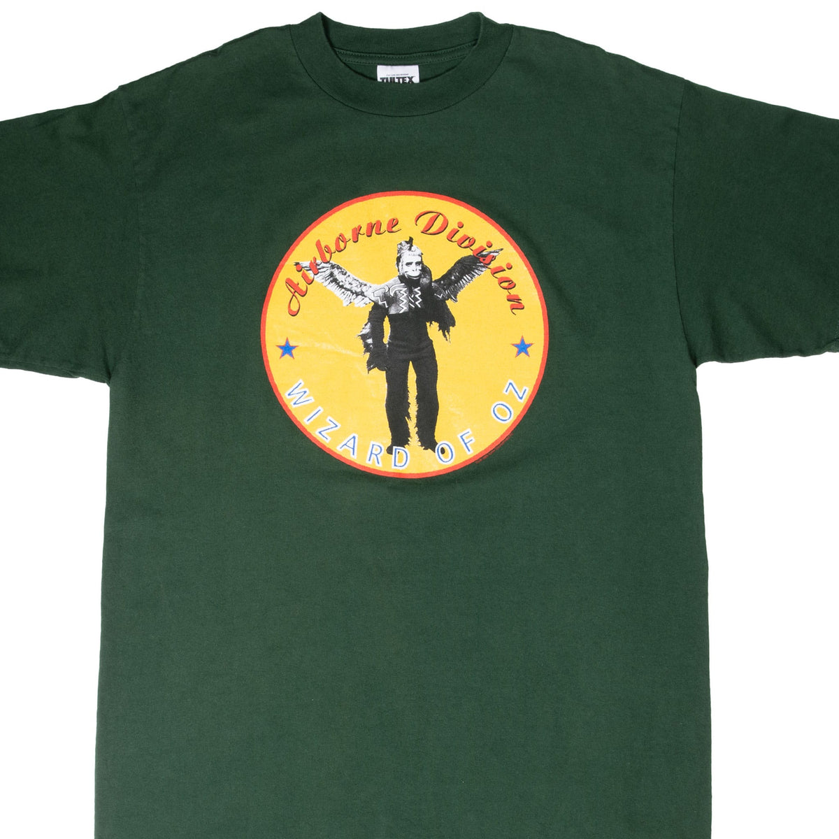 Front of dark green Wizard of Oz T-shirt with circular yellow Airborne Division graphic