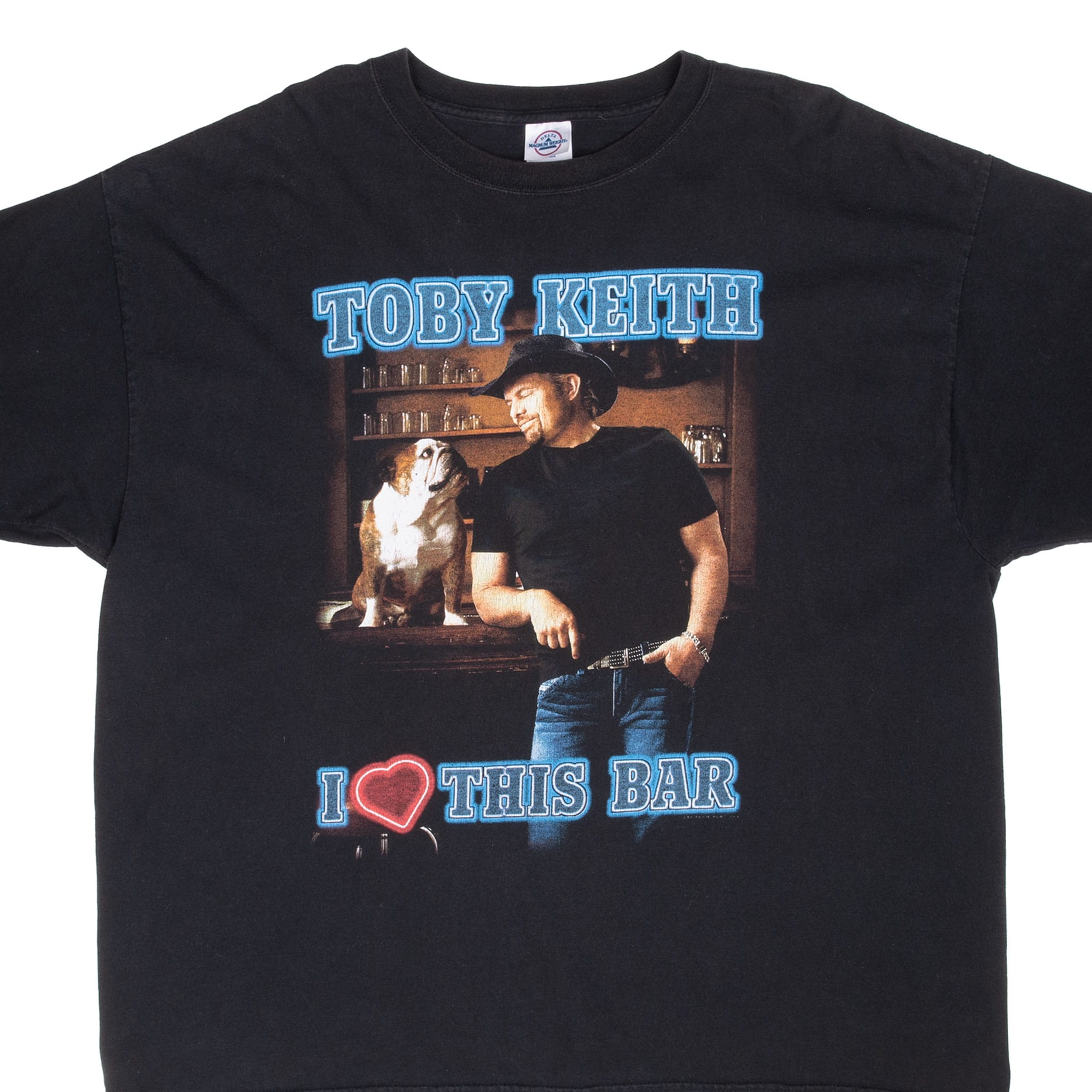 Close view of black Toby Keith T-shirt front with dog at bar and I Love This Bar graphic