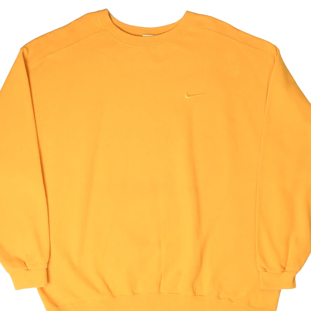 Front of yellow Nike crewneck sweatshirt with small tonal embroidered Swoosh