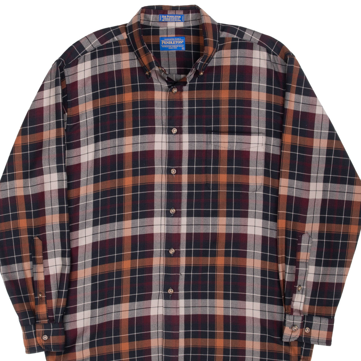 Front upper view of Pendleton brown, burgundy, black and cream plaid wool button-down shirt