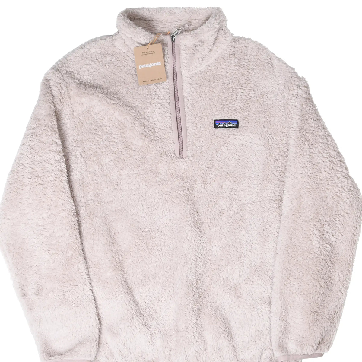 Front of beige Patagonia Women's Los Gatos quarter-zip fleece with hang tag