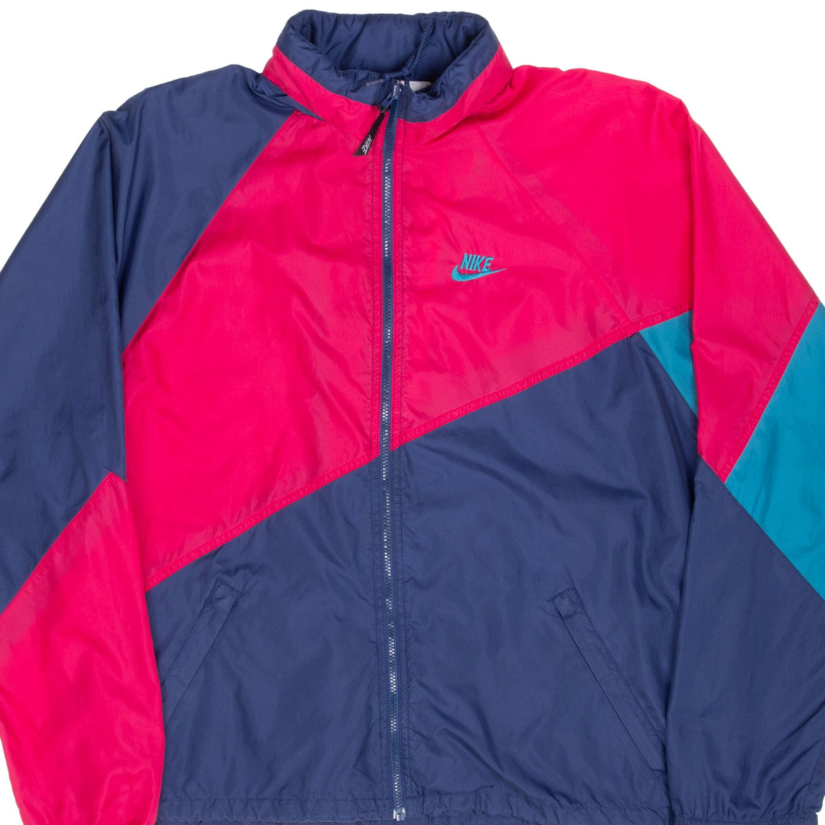 Front detail of pink, navy and teal Nike color-block windbreaker jacket