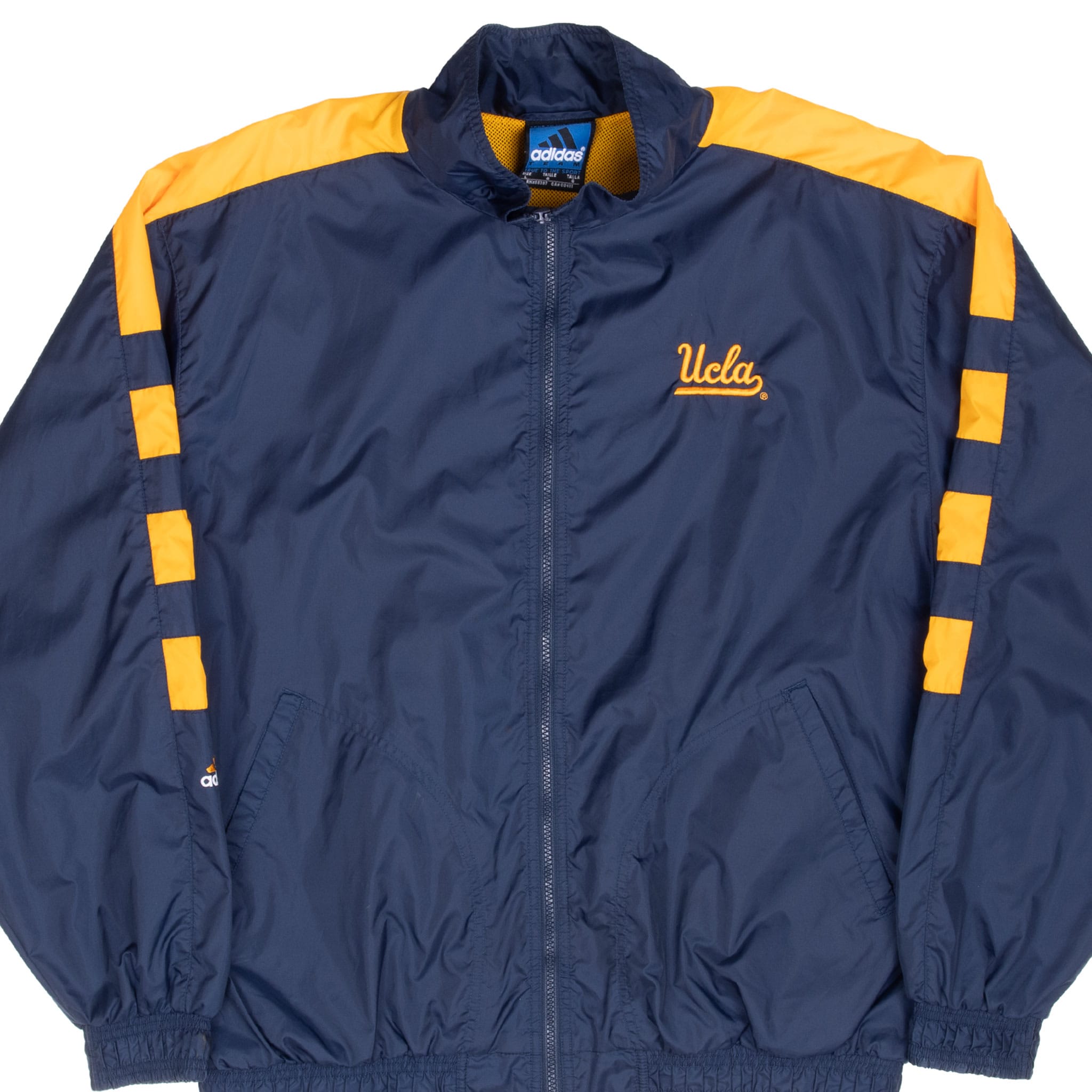 Front of blue adidas UCLA windbreaker with gold shoulder and sleeve panels