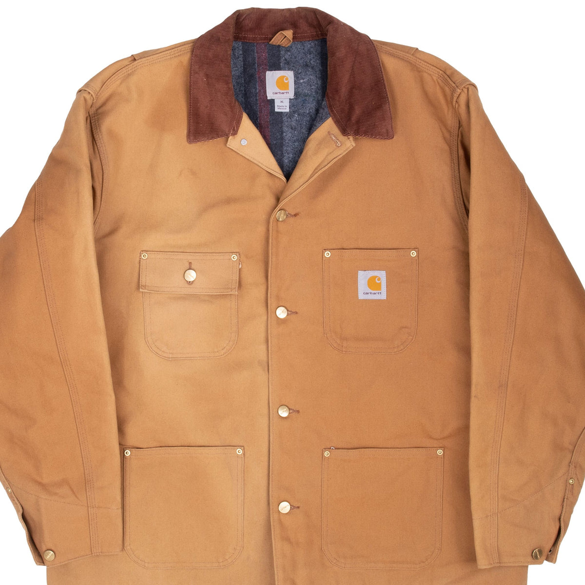Front detail of brown Carhartt Michigan chore jacket with contrast collar, buttons and four patch pockets