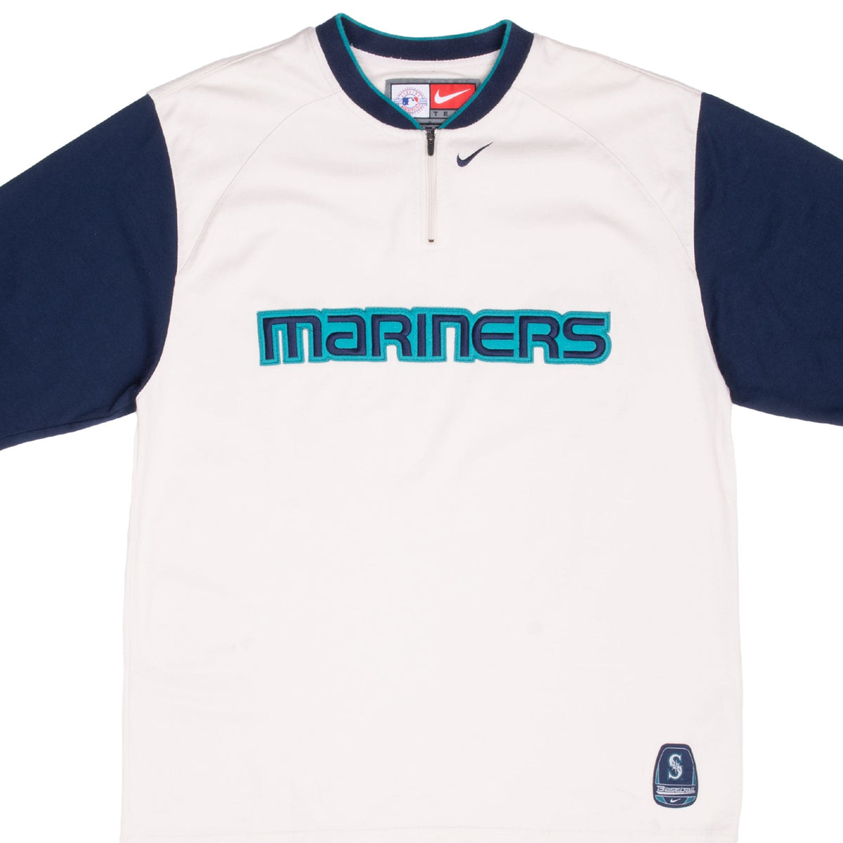 Front of Nike Seattle Mariners quarter-zip shirt with white body, navy sleeves and embroidered lettering