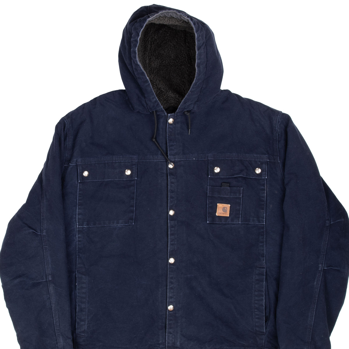 Front detail of navy blue Carhartt hooded jacket with snap closure, chest pockets, and sherpa-lined hood