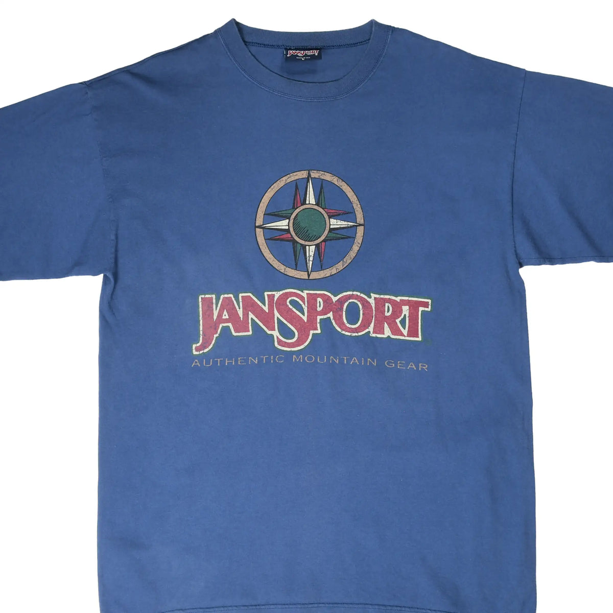 Front of blue JanSport T-shirt with compass graphic and Authentic Mountain Gear text