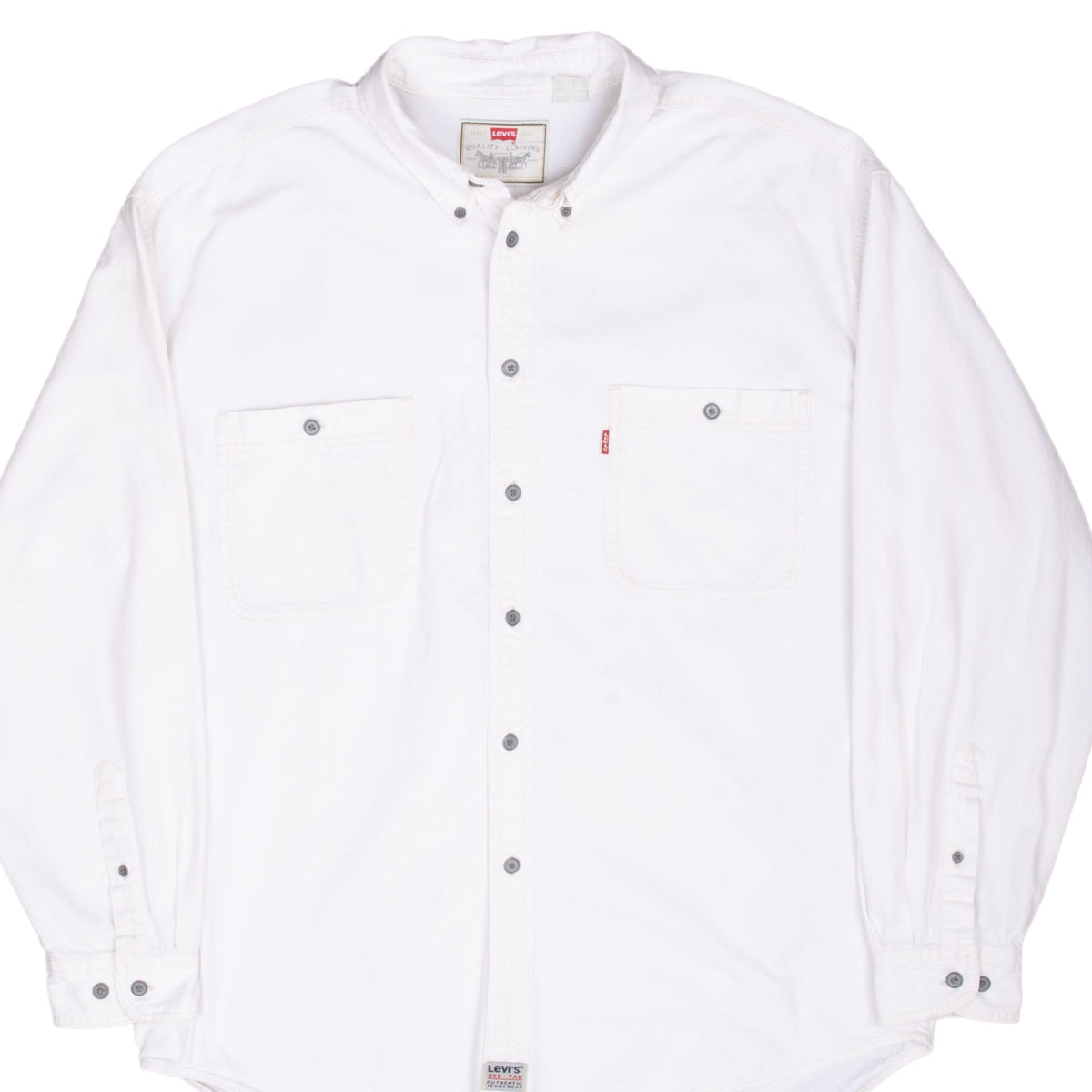 Front of Levi's white denim shirt with two chest pockets, dark buttons and red tab