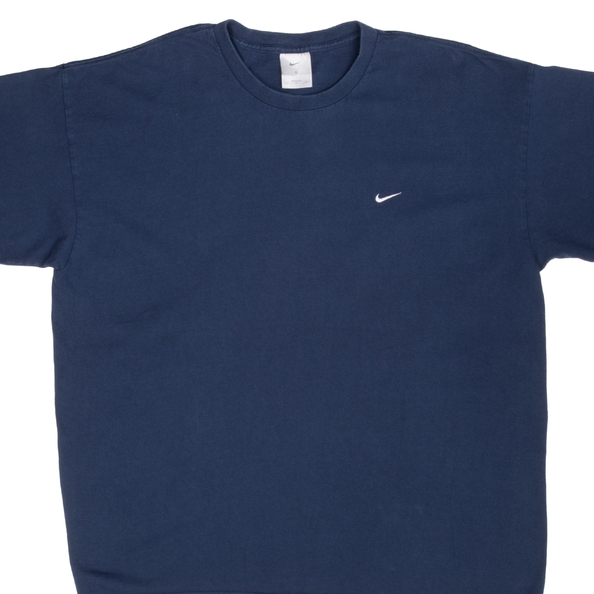 Front upper view of navy blue Nike crewneck T-shirt with small white embroidered Swoosh