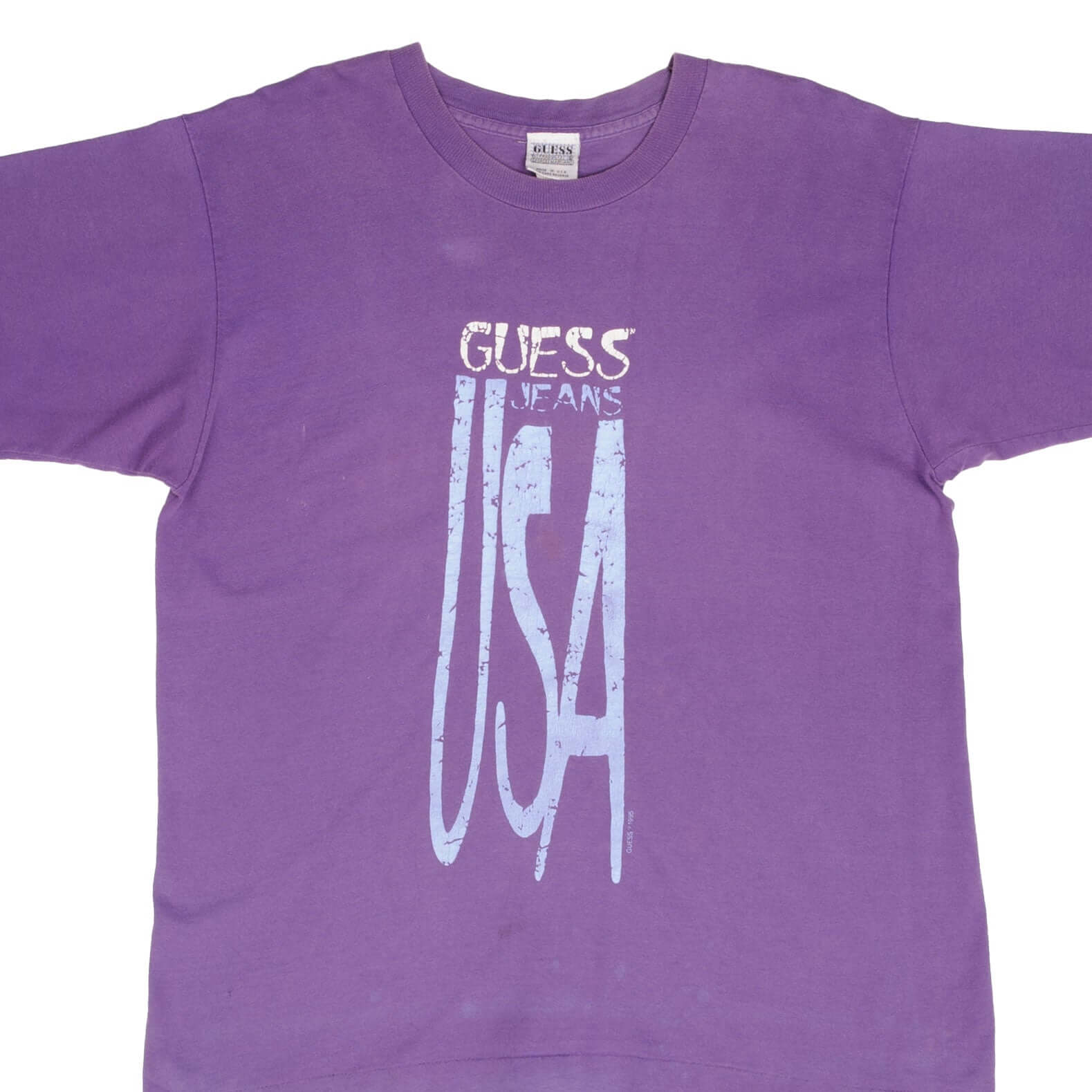 Front upper view of purple Guess Jeans T-shirt with light blue USA graphic
