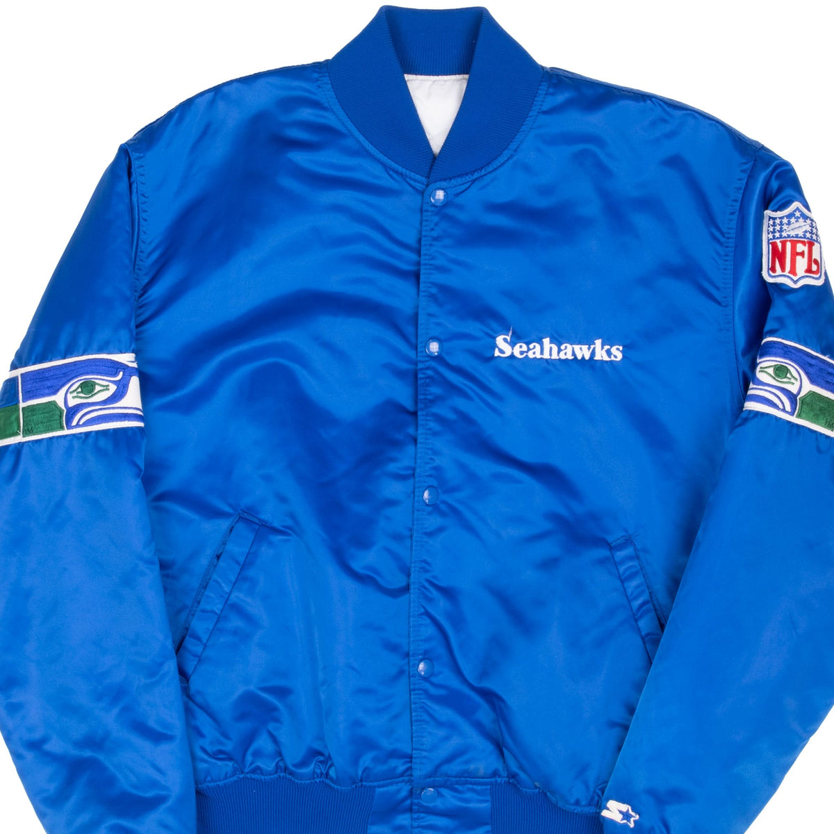 Front detail of blue Seattle Seahawks Starter jacket with chest embroidery and sleeve logos