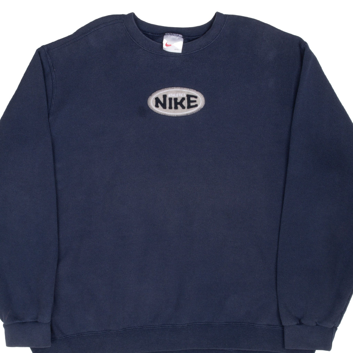 Front of blue Nike crewneck sweatshirt with centered oval Nike Athletics patch
