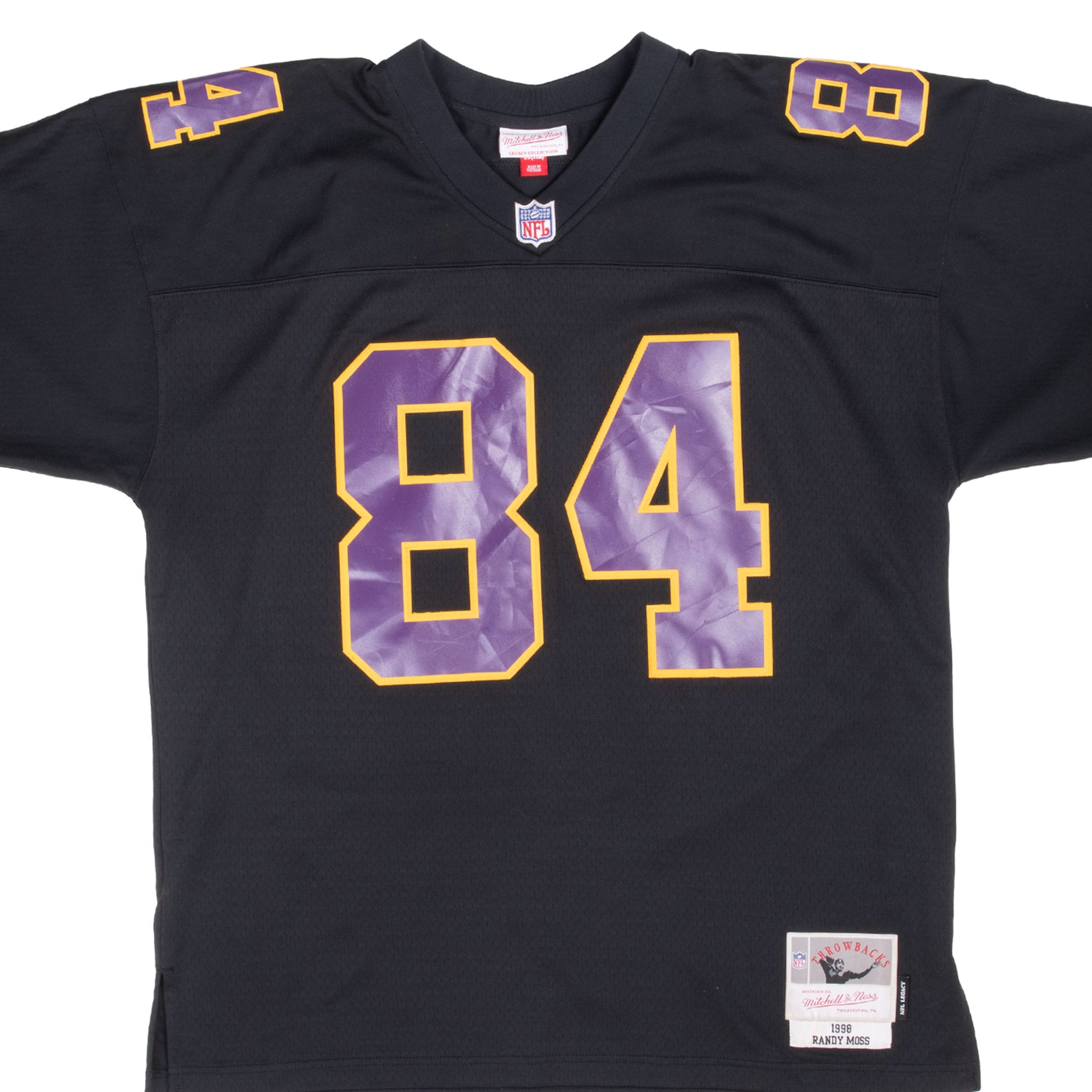 Front detail of black Minnesota Vikings Randy Moss jersey with purple and gold number 84