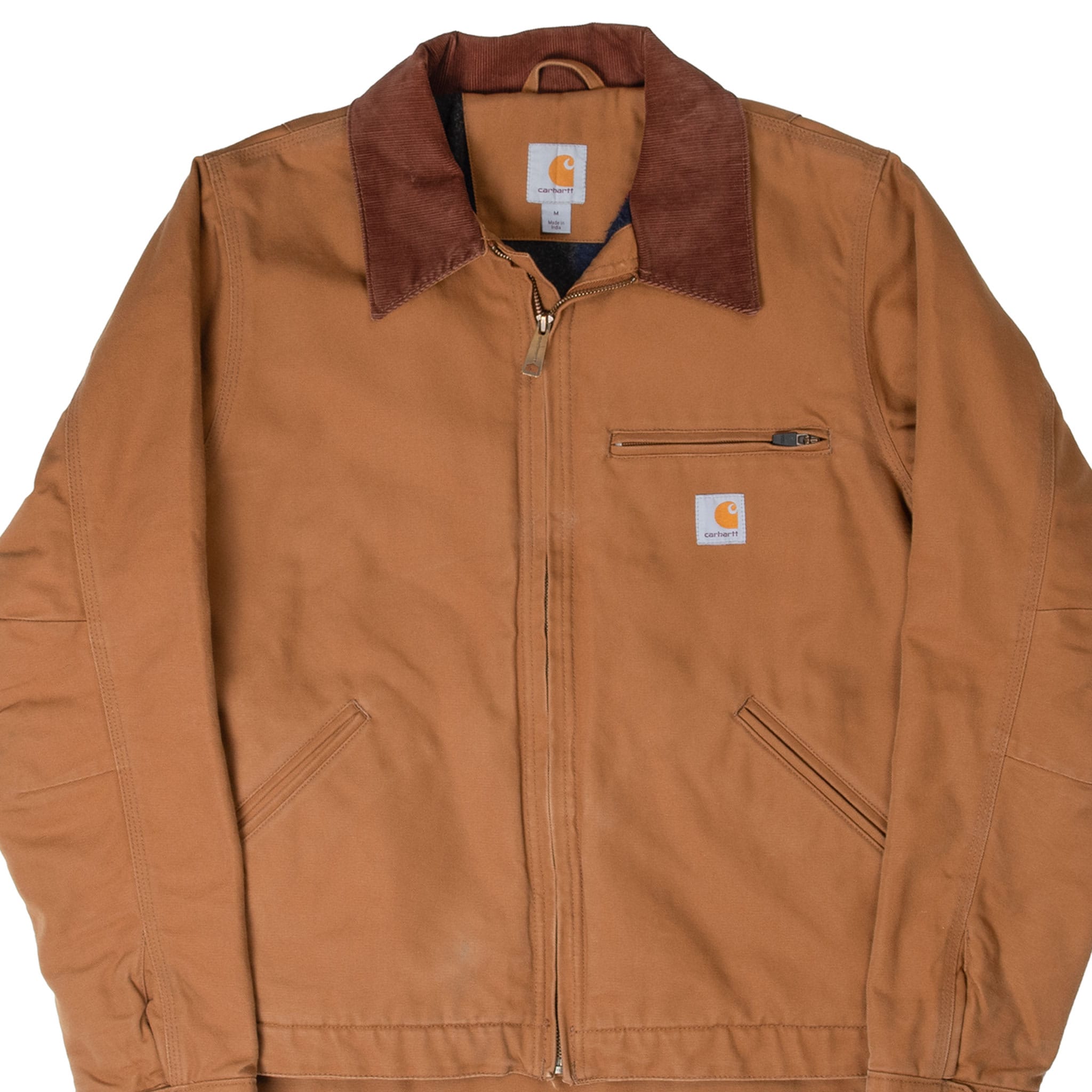 Front detail of brown Carhartt Detroit jacket with corduroy collar, zip chest pocket and logo patch
