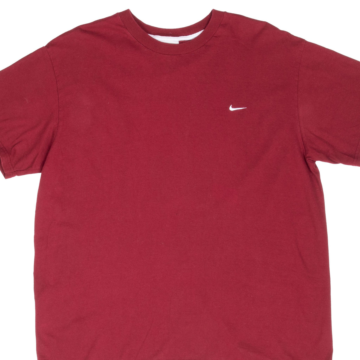 Close front view of burgundy Nike T-shirt with small white Swoosh embroidery