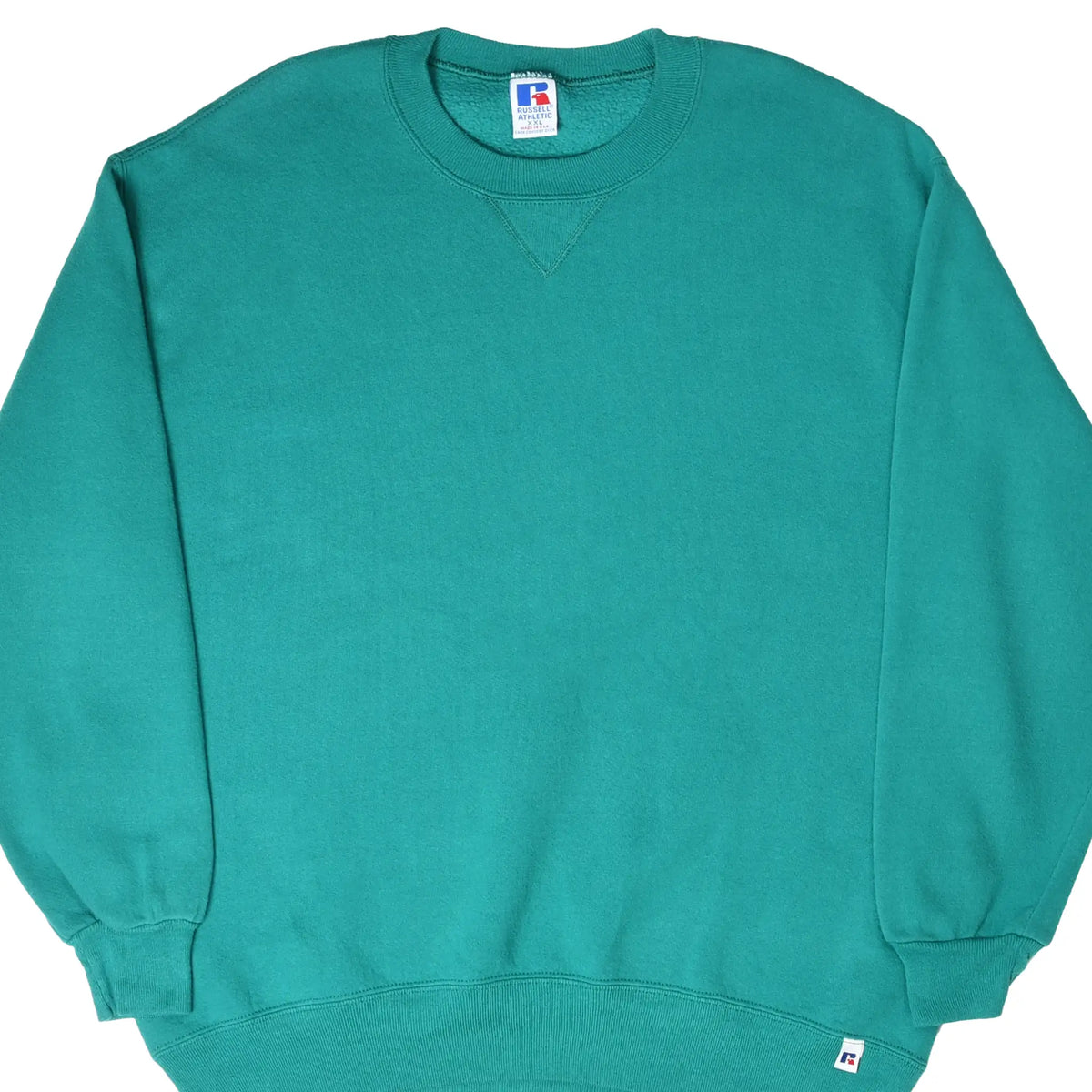 Front of teal Russell Athletic crewneck sweatshirt with ribbed cuffs and hem