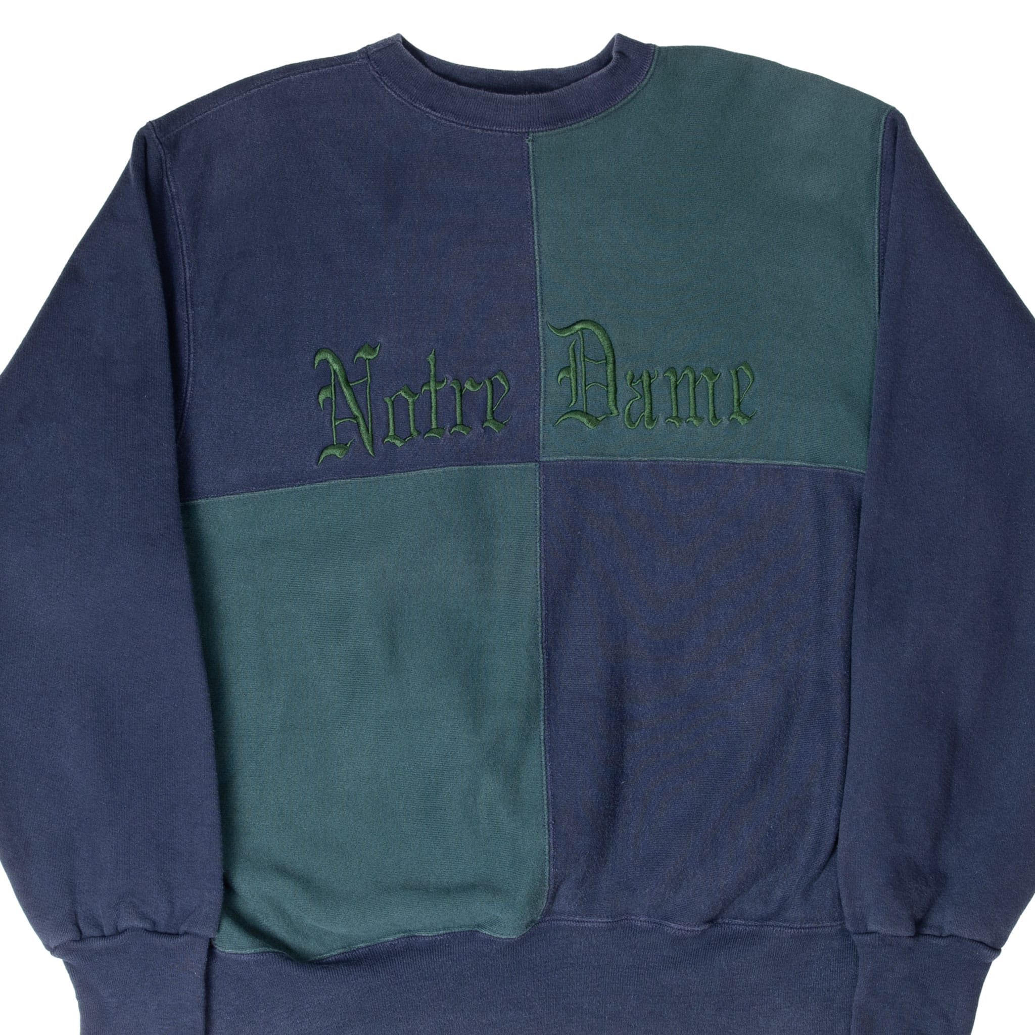 Front of navy and green quartered Notre Dame crewneck sweatshirt with Gothic embroidery