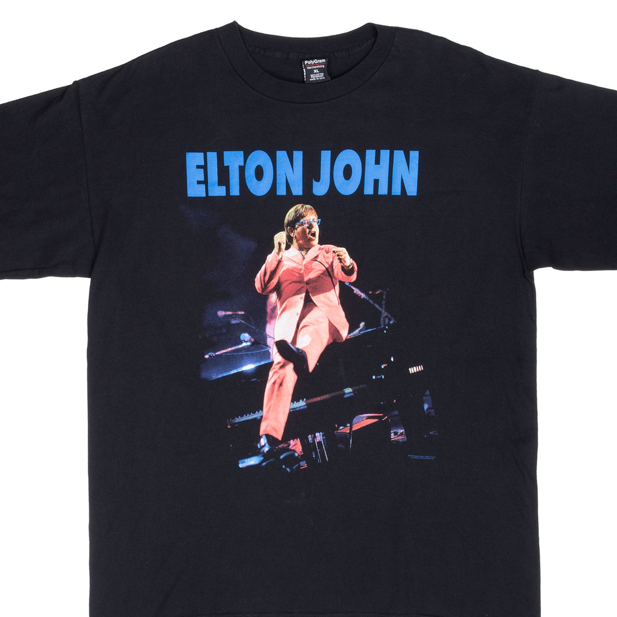 Upper front of black Elton John tour T-shirt with blue lettering and performance print