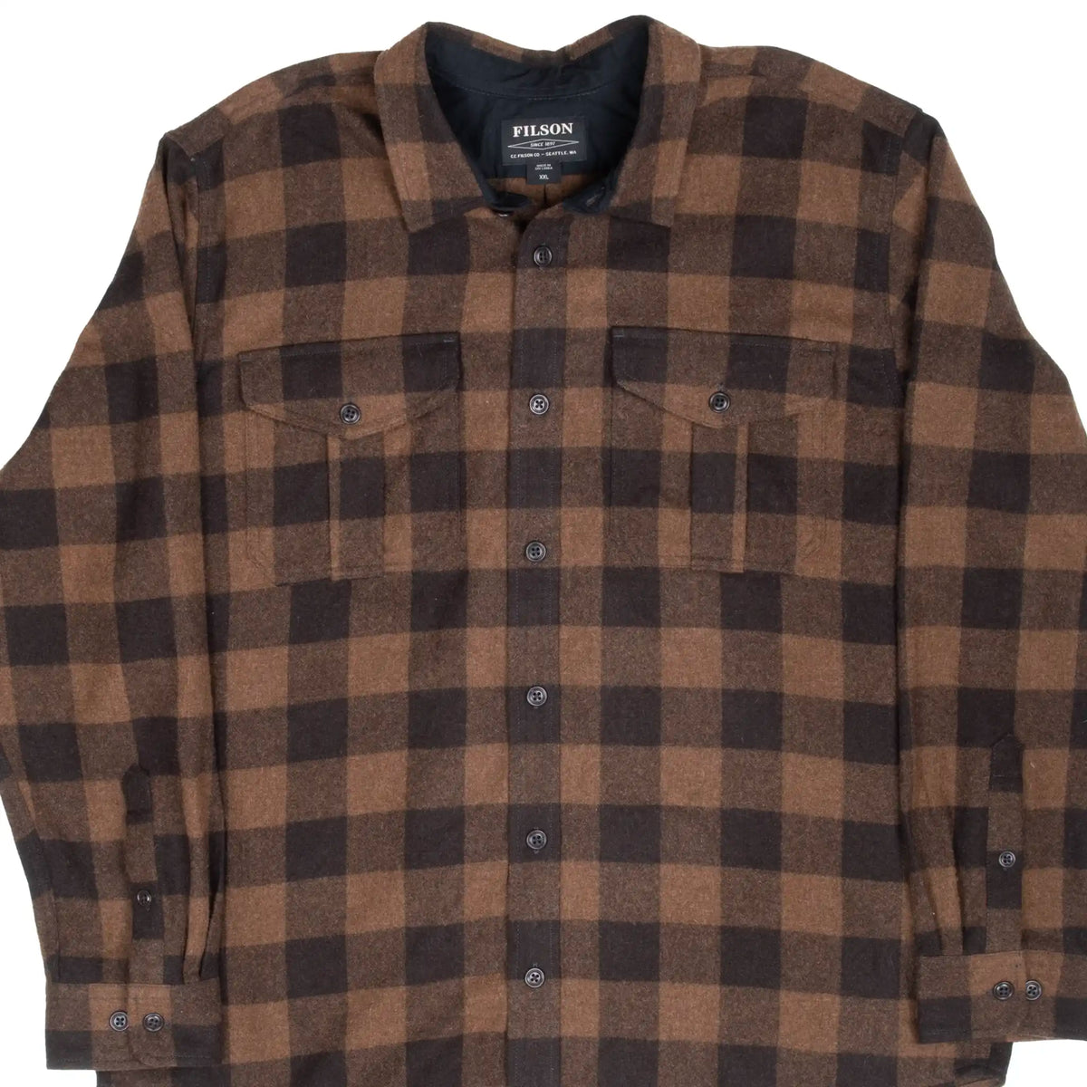 Front of Filson brown and black plaid flannel shirt with buttoned chest pockets