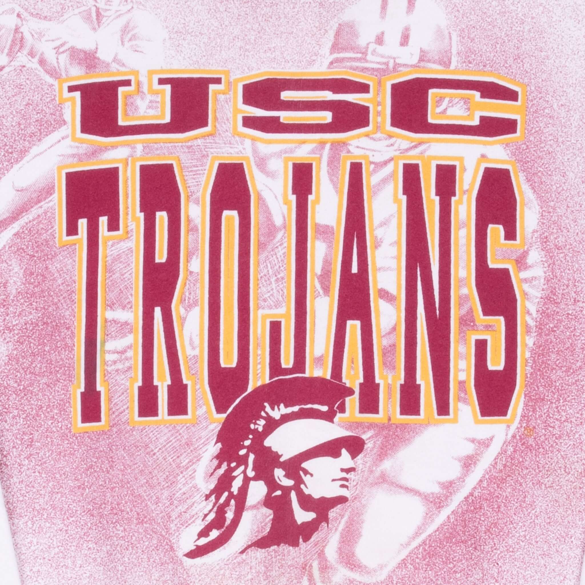 Close-up of cardinal and gold USC Trojans lettering and Trojan head graphic