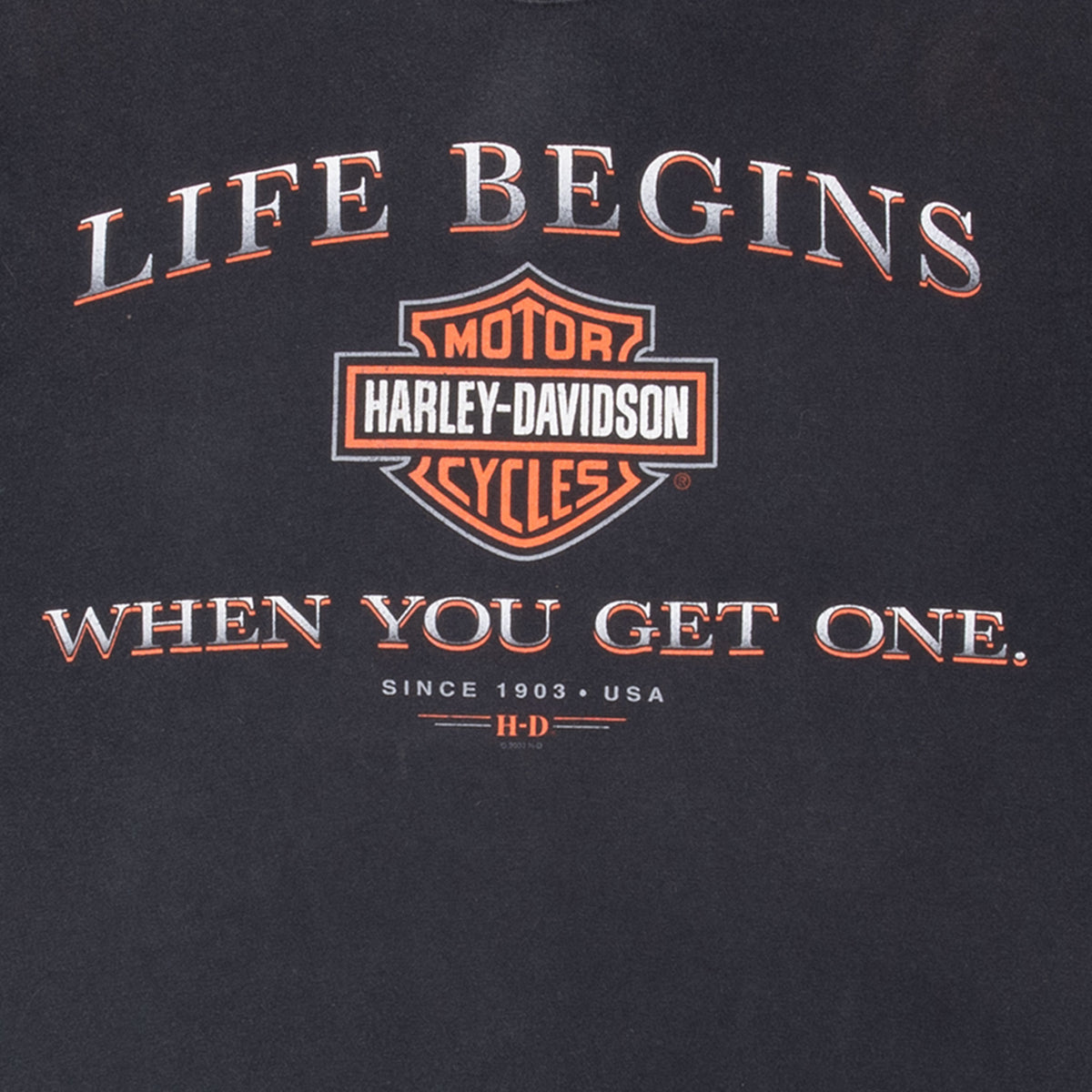 Front print detail with Harley-Davidson logo and “Life Begins When You Get One” text
